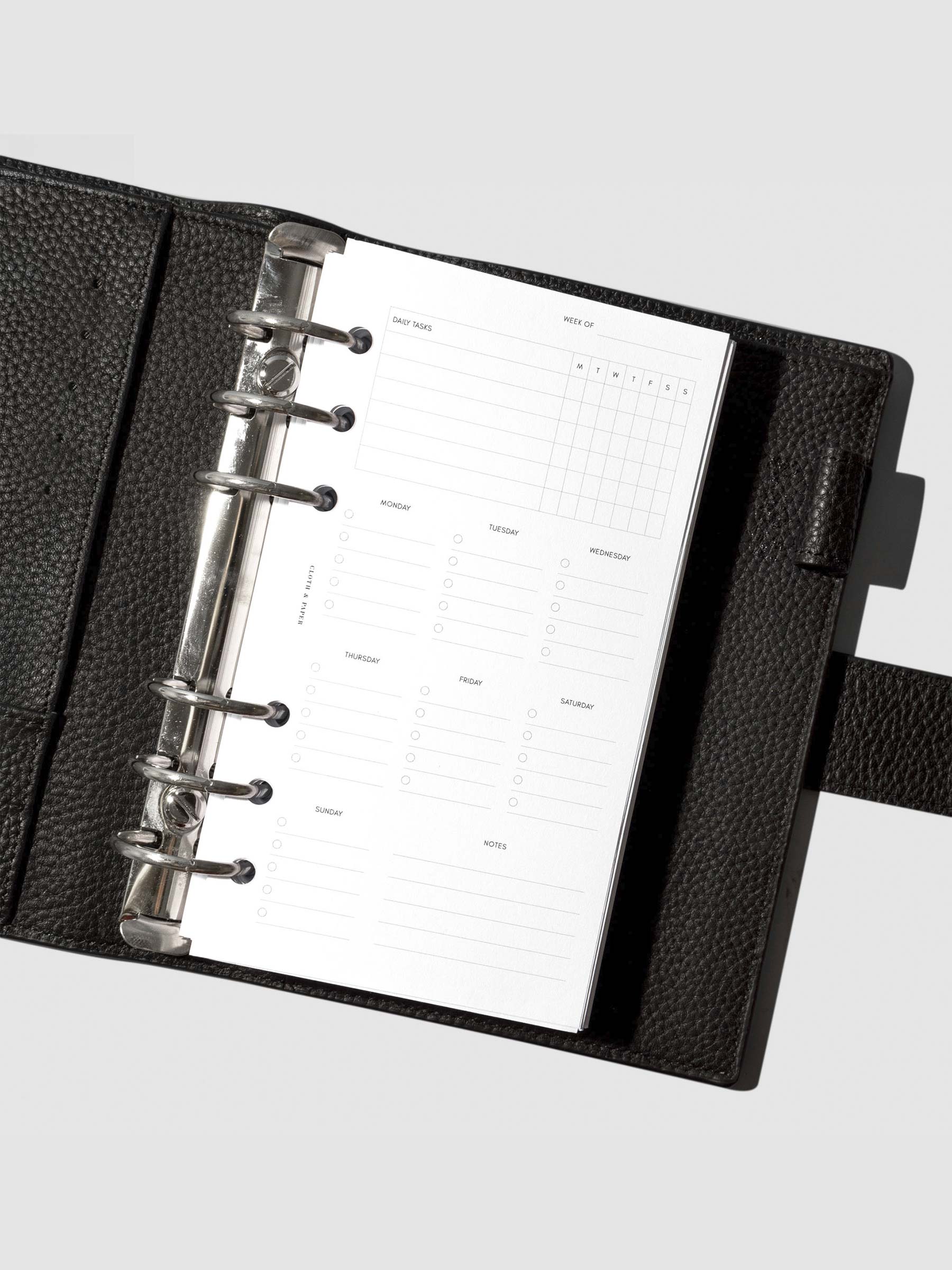 Insert in use inside a black leather planner.