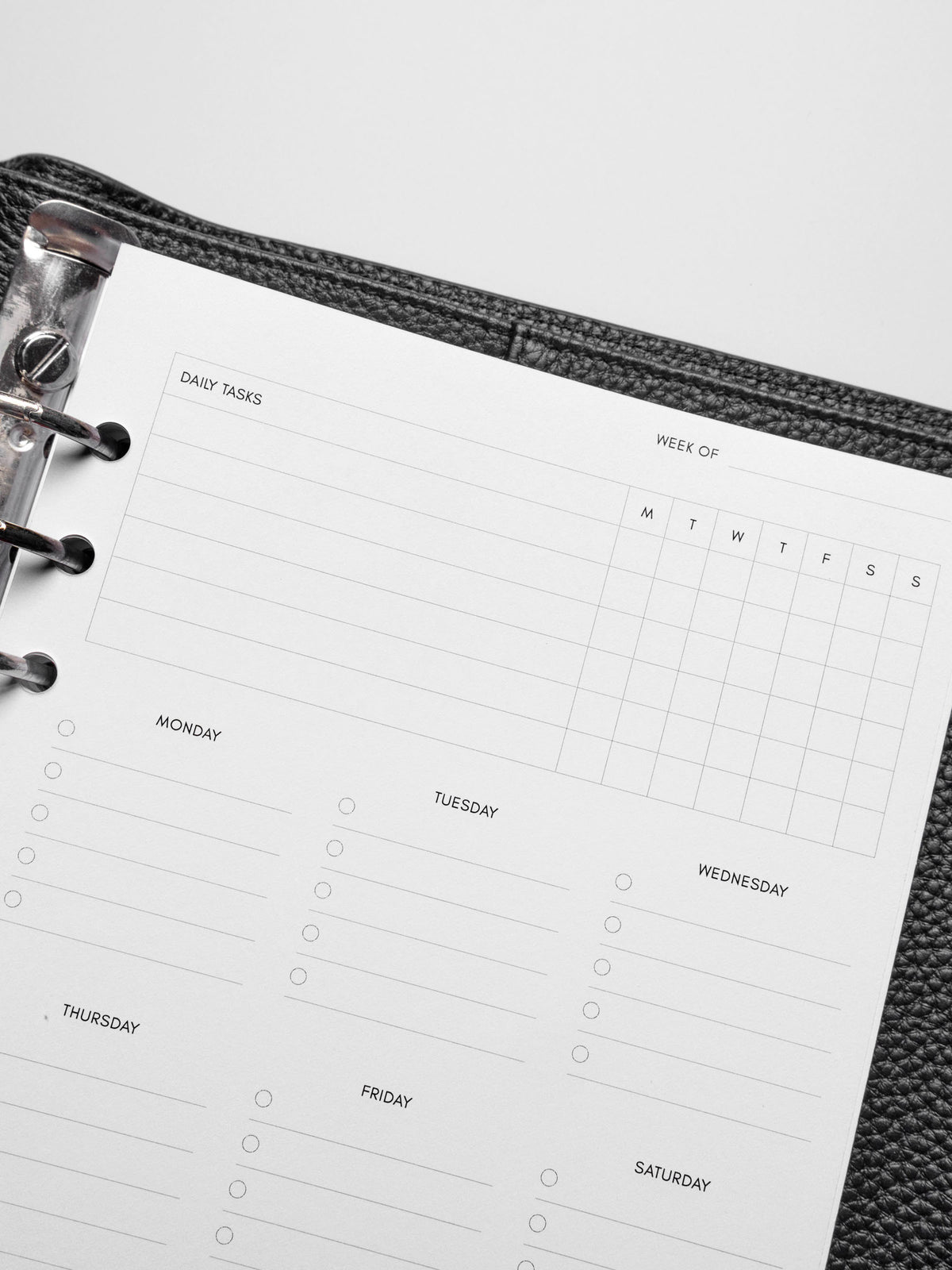 Insert in use inside a black leather planner.
