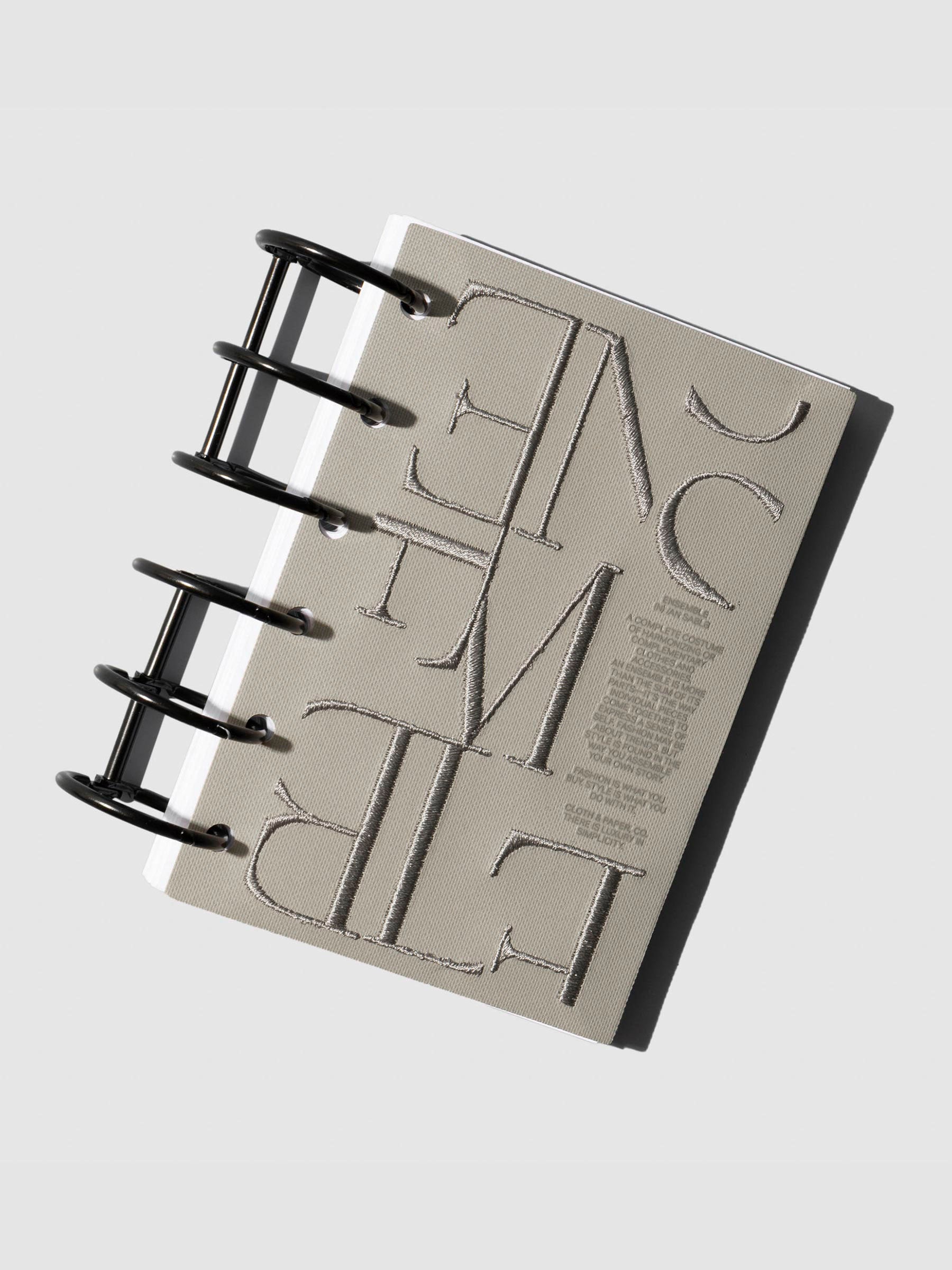 Pocket size Ensemble Dashboard Ristretto design displayed in planner rings.