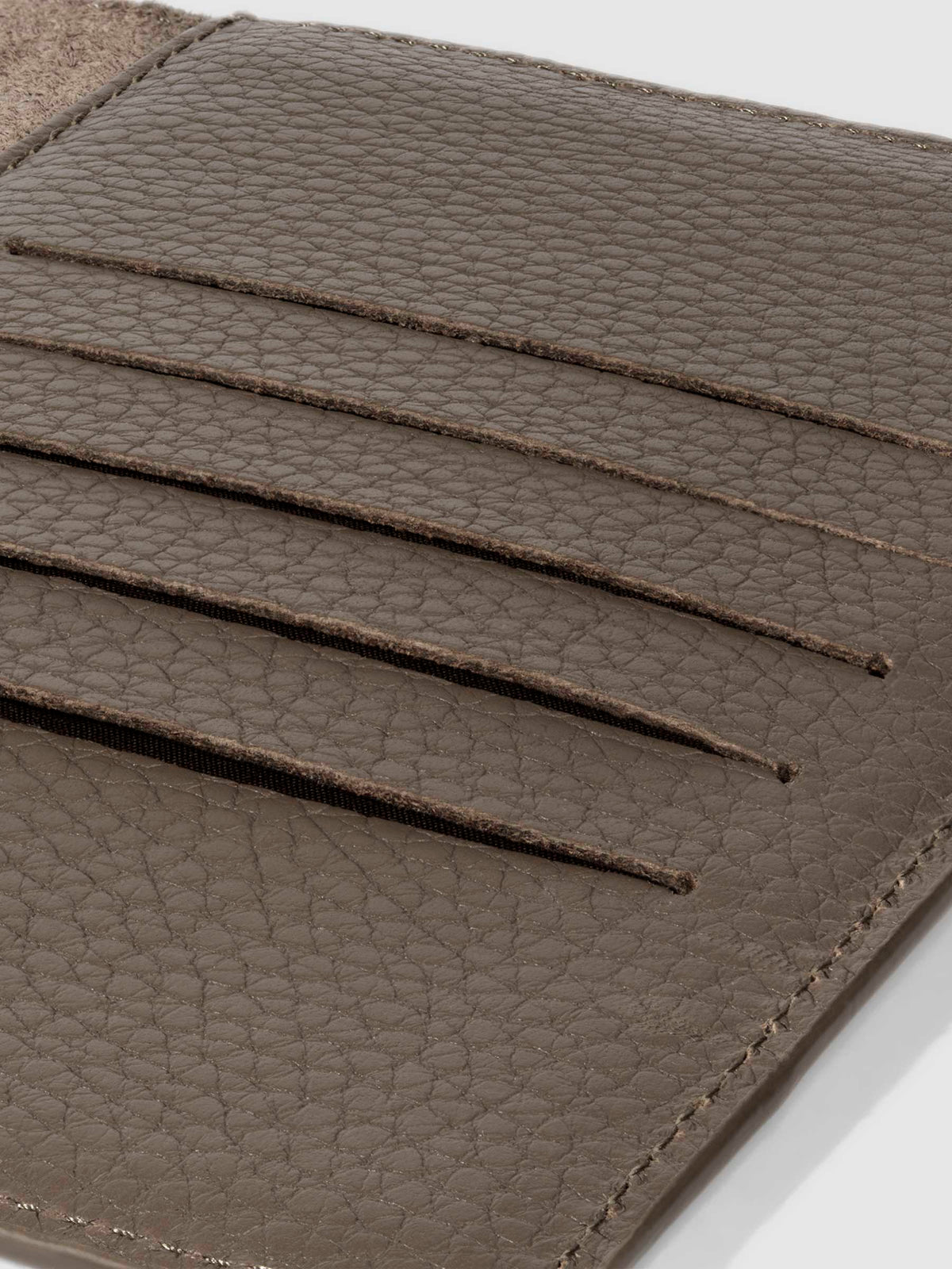Closeup of Leon folio showing the hand-cut credit card slots.
