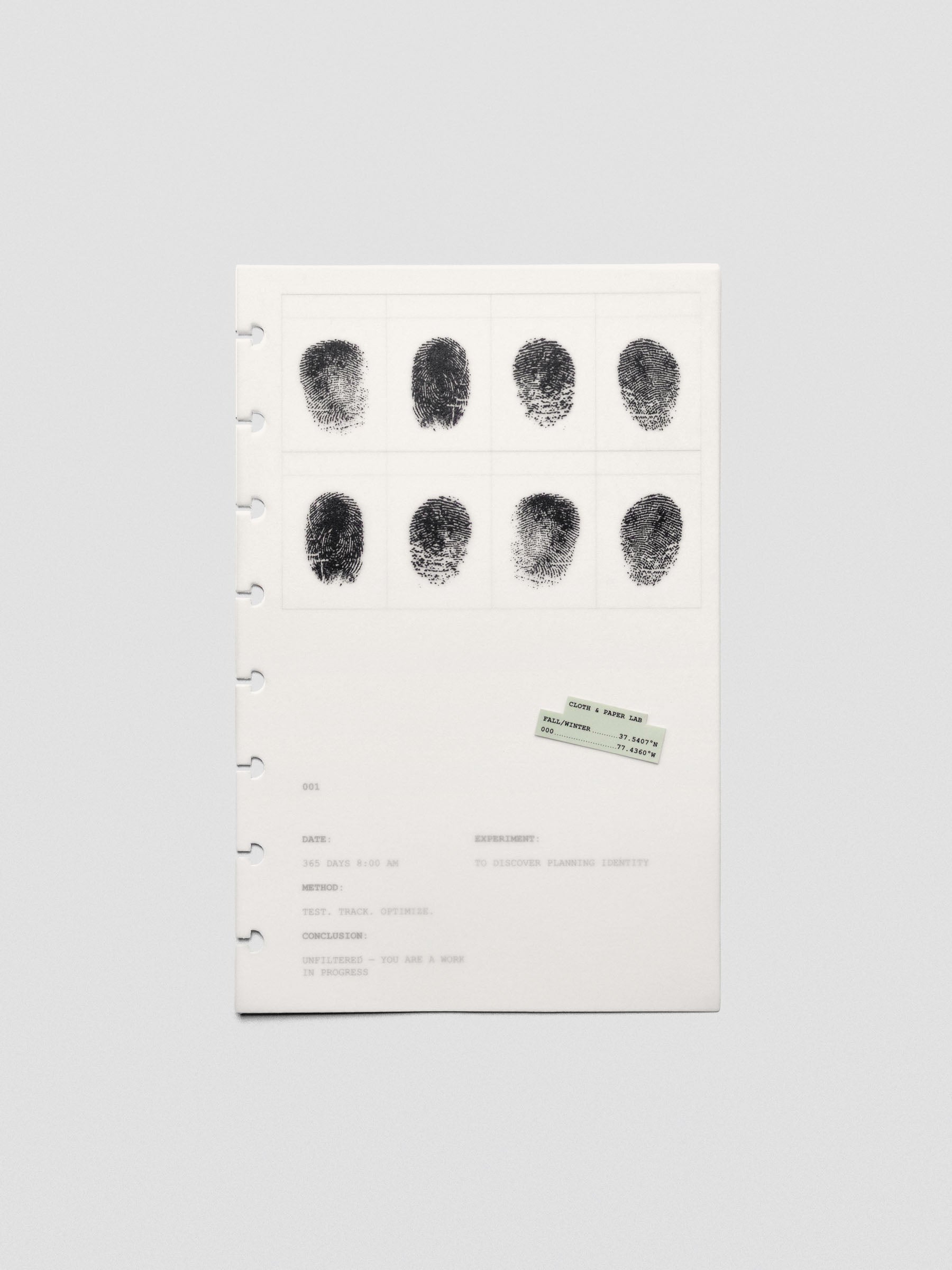 Two layered Half Letter sized planner dashboards, one semi-transparent, one matte, featuring a fingerprint design.