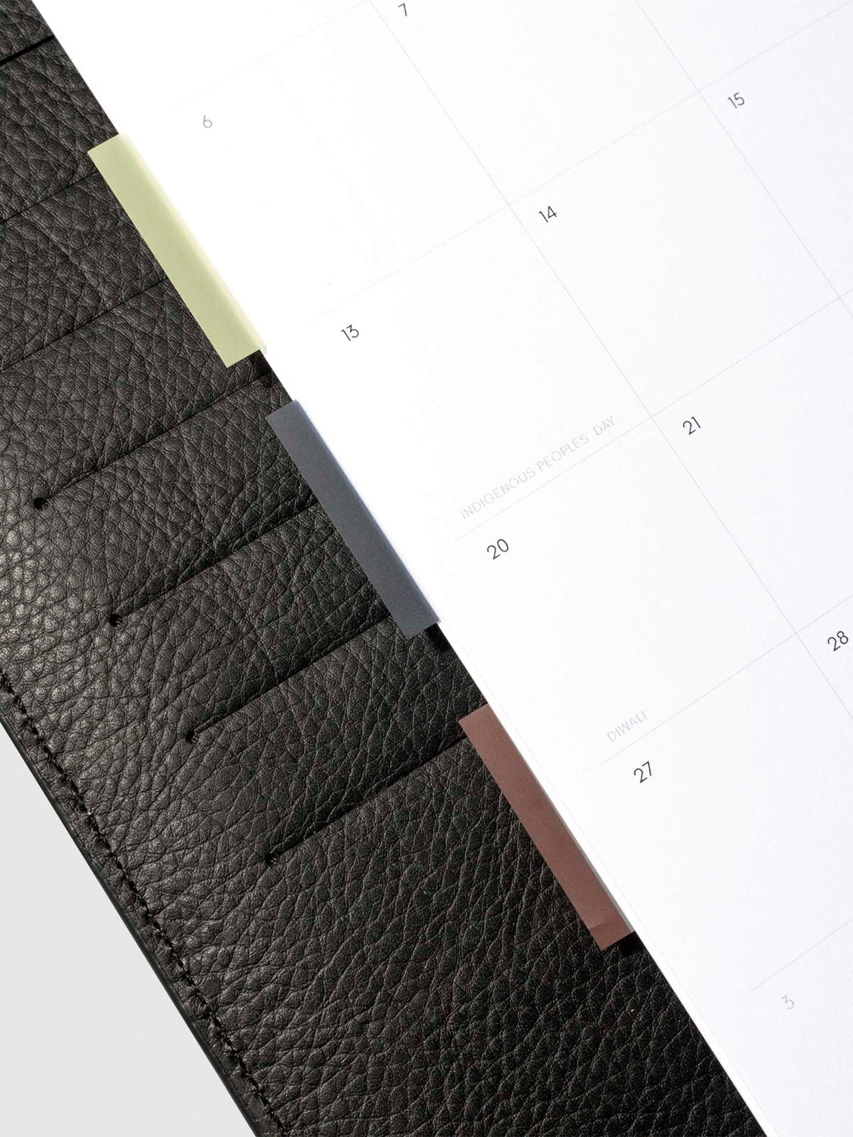 Set of 3 page flags in use inside a black leather planner.