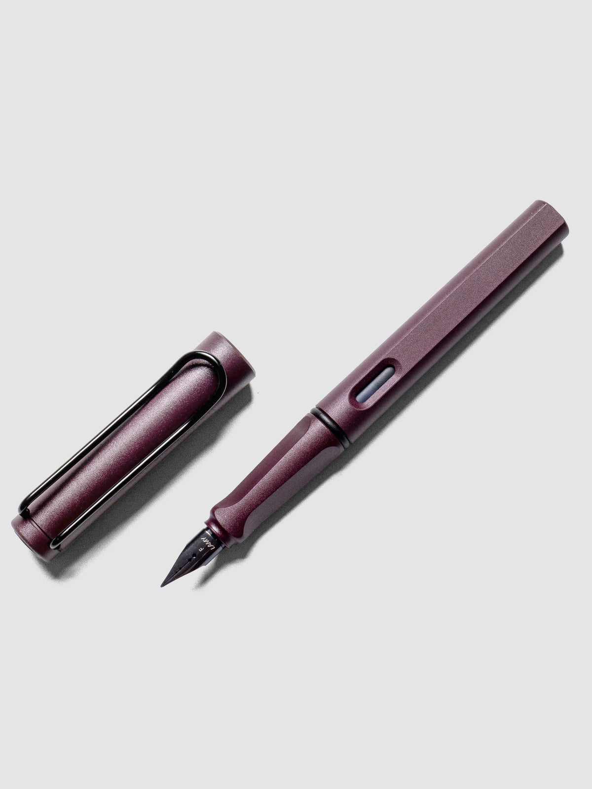 LAMY Safari Fountain Pen in the color Scarlett with Fine nib shown diagonally with the cap off.