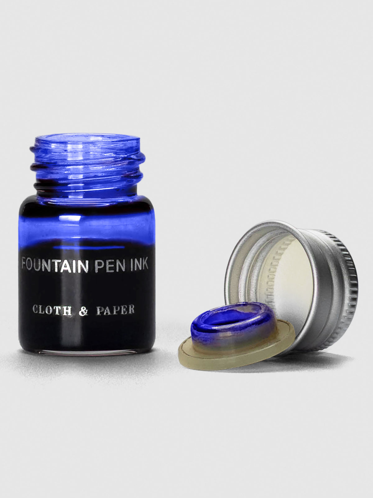 Indigo Mini Fountain Pen Ink shown with cap off bottle.