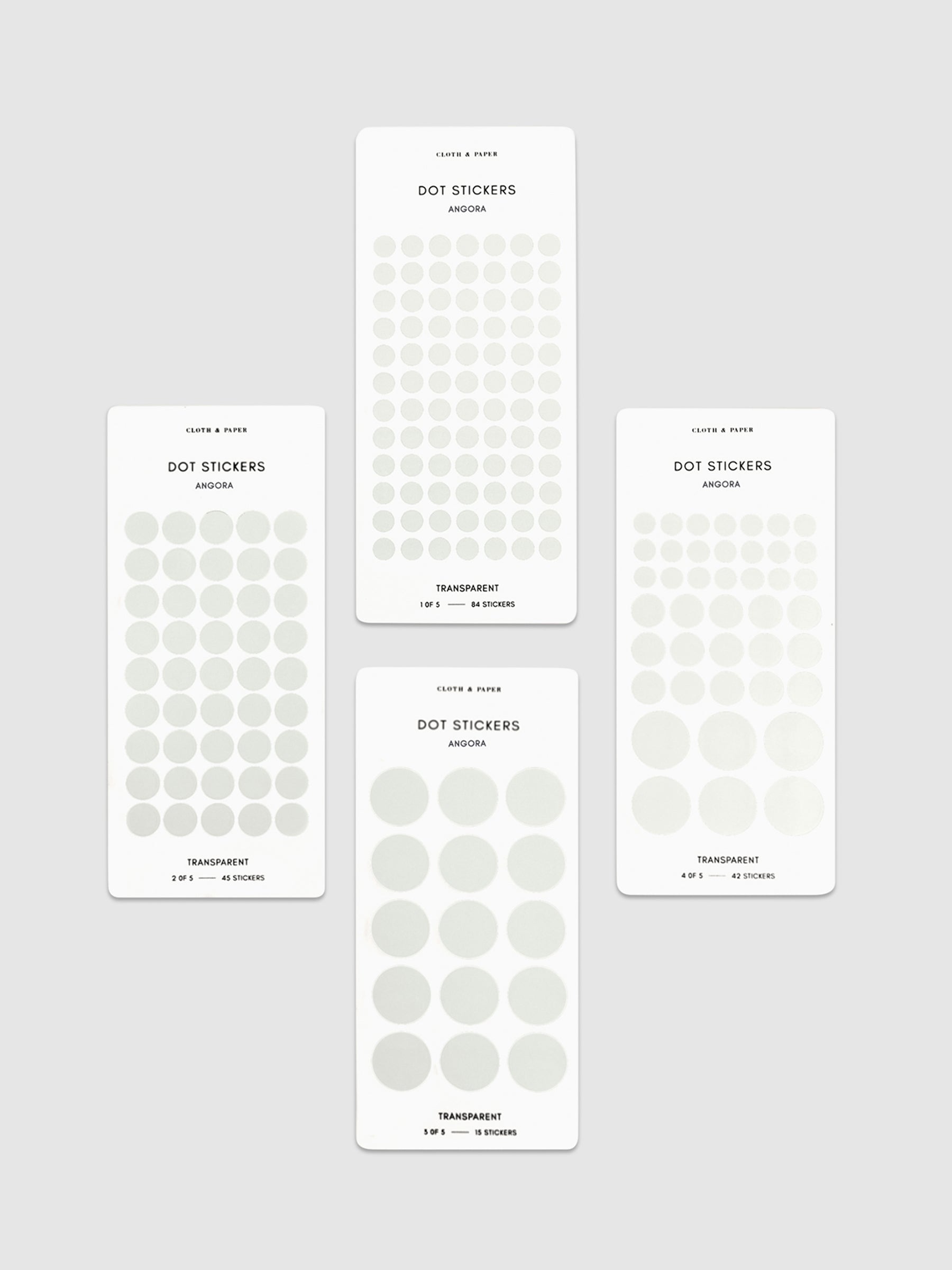 Four sheets of Angora dot stickers in different sizes arranged parallel to each other.