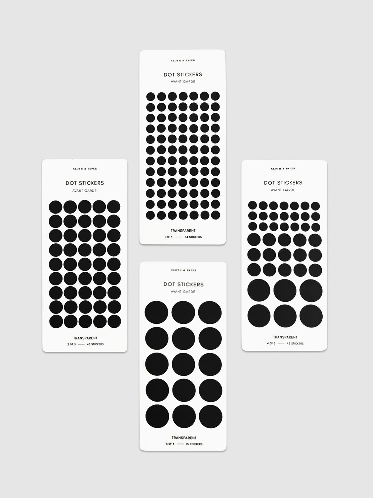 Four sheets of Avant Garde dot stickers in different sizes shown parallel to each other on a neutral background.