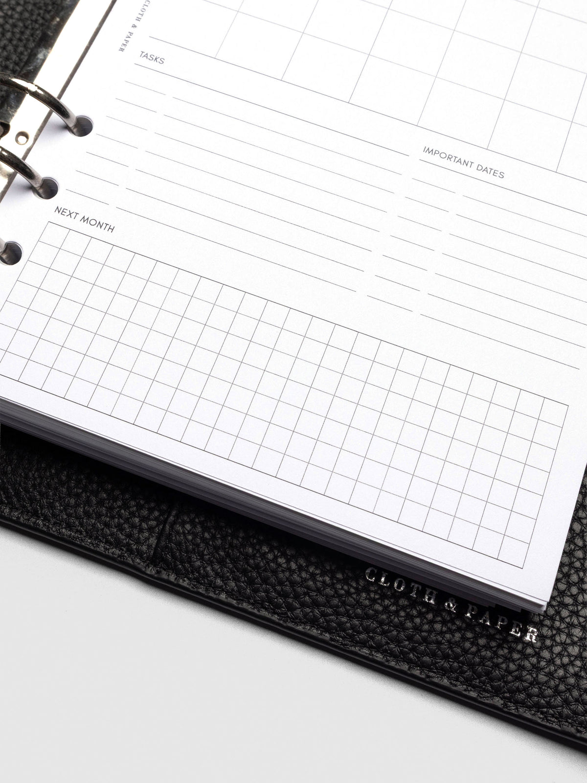 Insert in use inside a black leather planner.