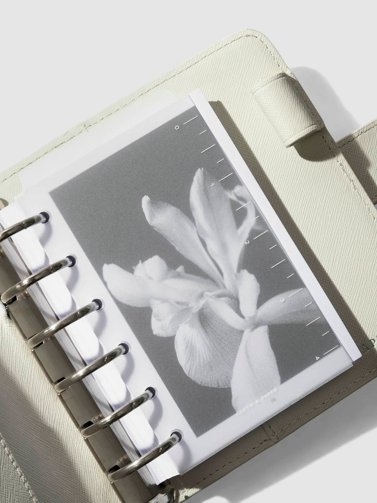 Page marker in use inside a ash leather agenda.