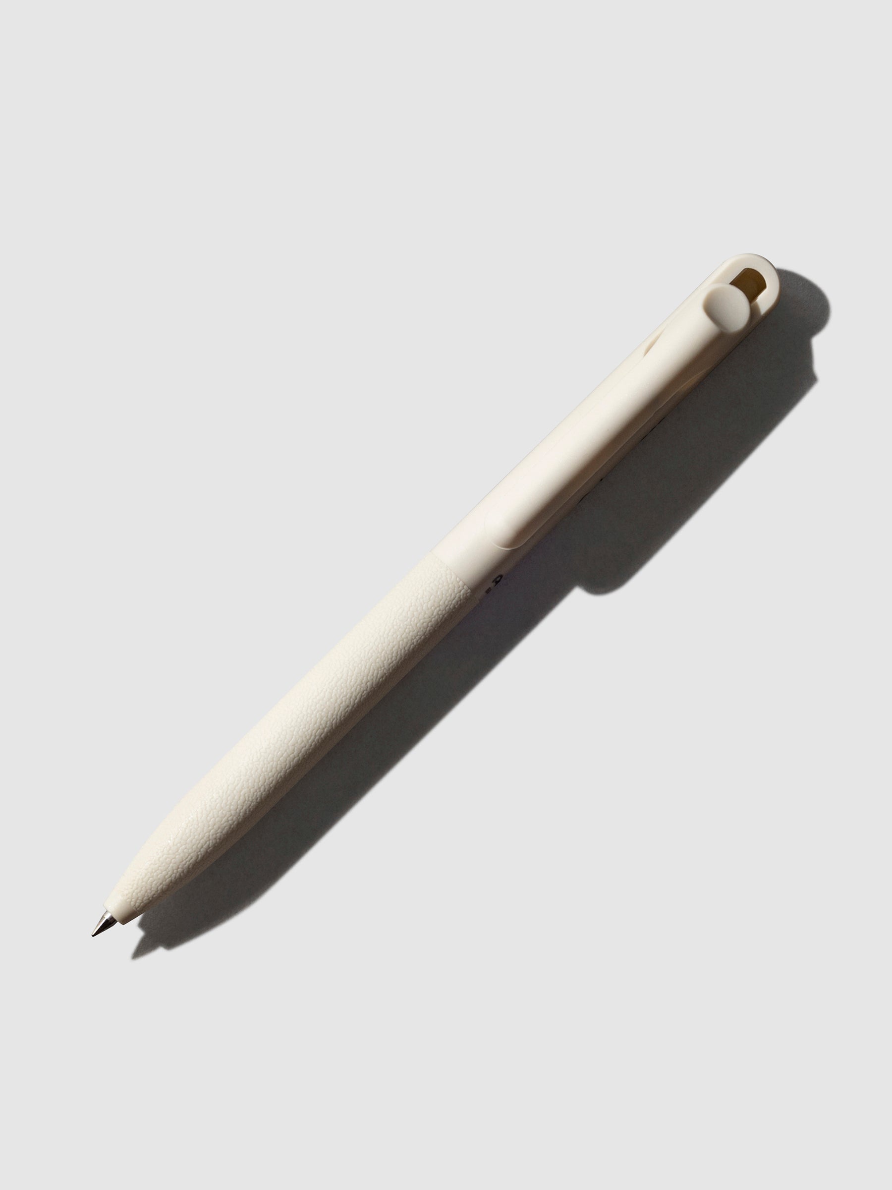Pentel Calme Gel Pen, Beige, Cloth and Paper. Pen displayed on a neutral background.