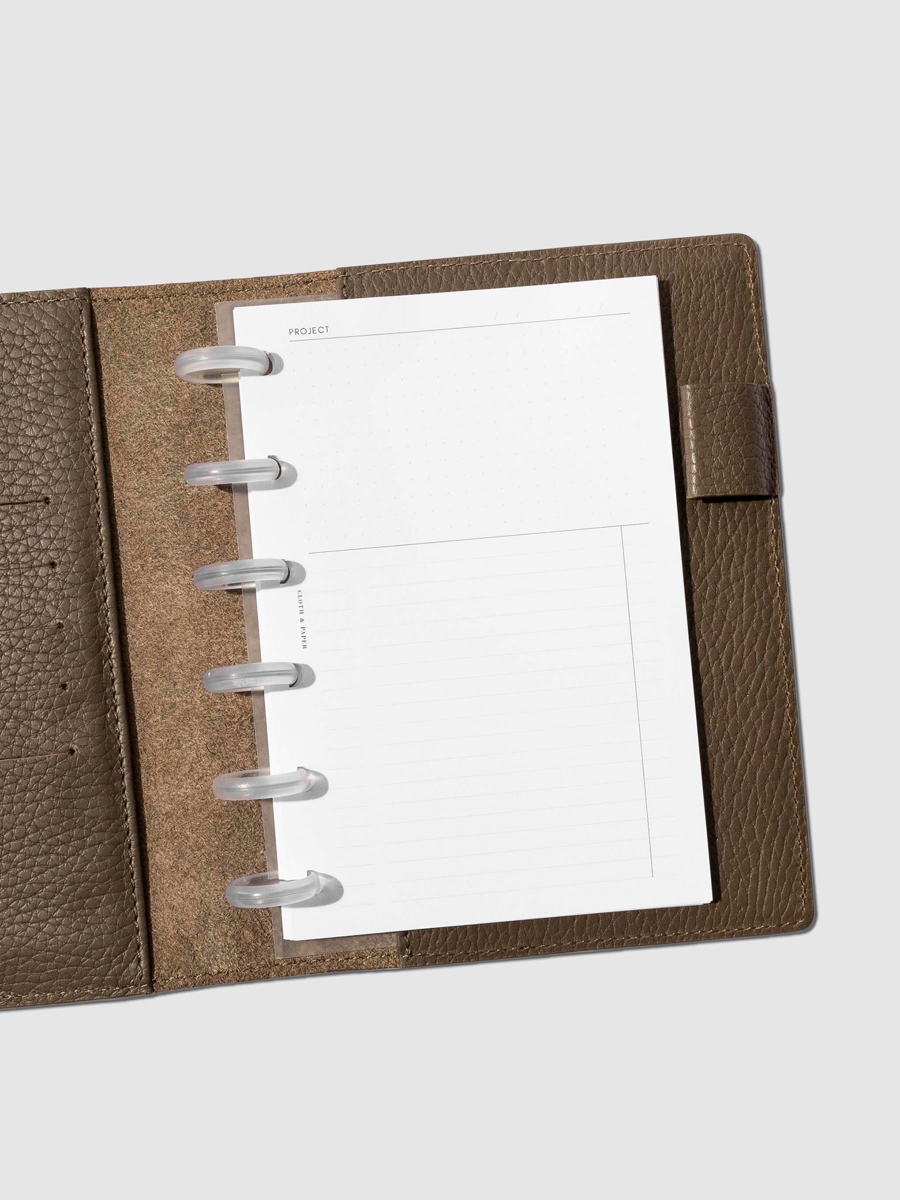 Insert in use inside a brown leather folio. Size pictured is CP Petite.
