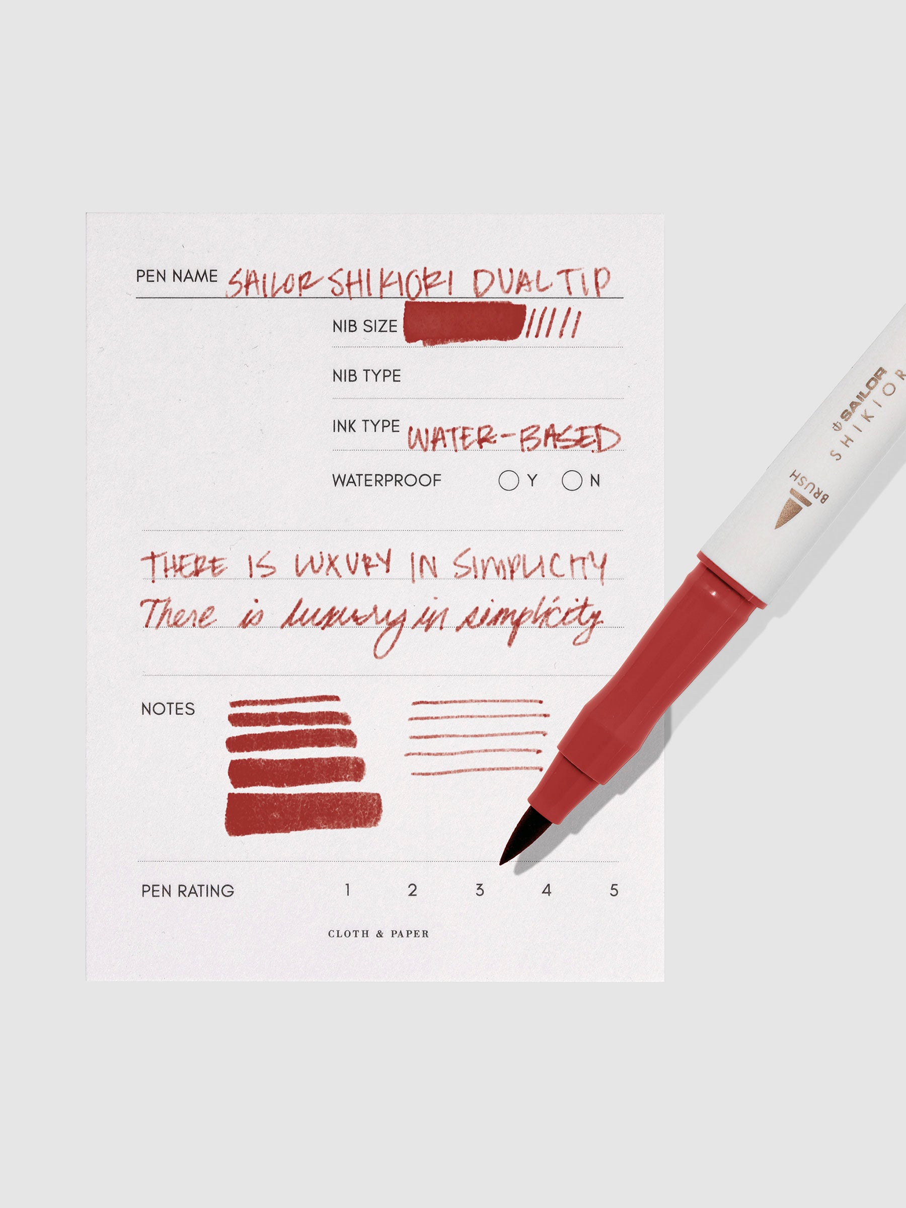 Pen displayed next to in use pen test sheet. Color pictured is Yodaki.