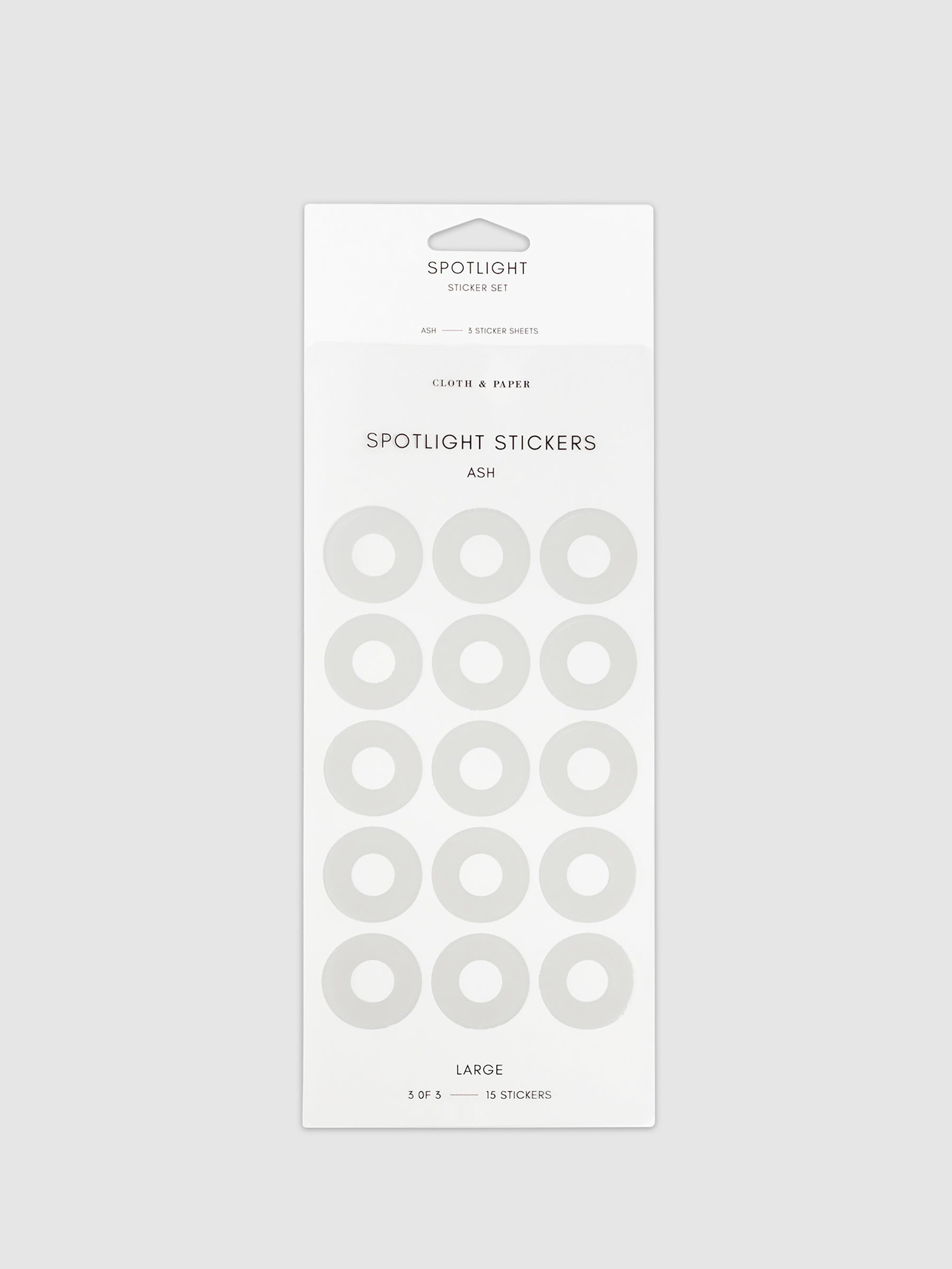 Large sticker in its packaging displayed on a neutral background. Pictured color is Ash.