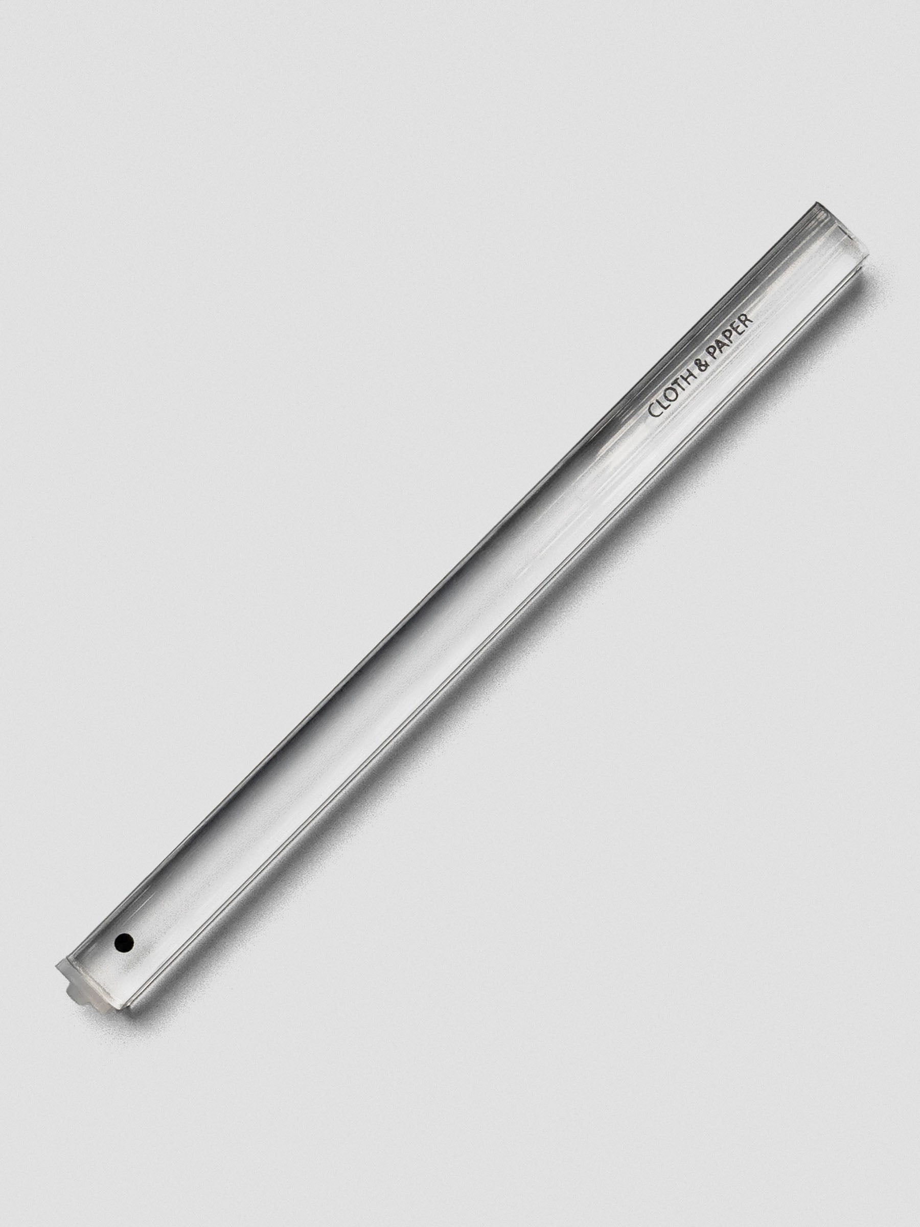 Single clear acrylic stamp stick with a filled black circle icon on the end and the Cloth & Paper logo on the side.