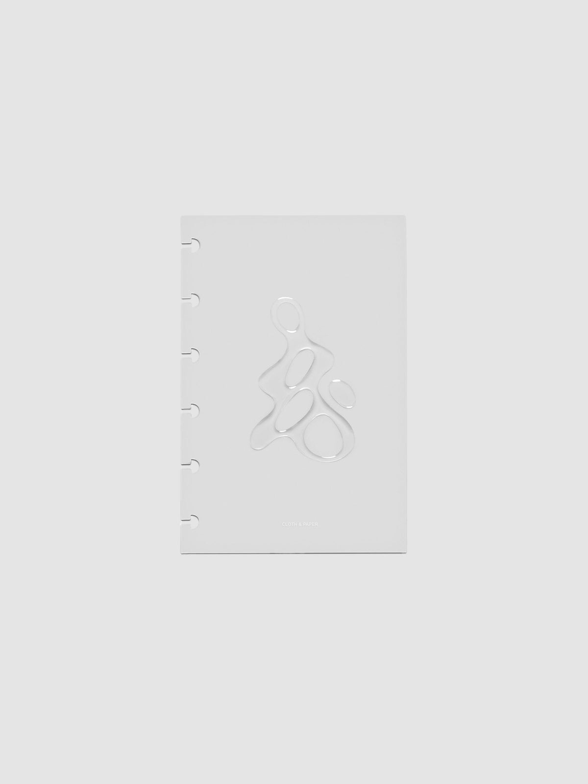 Light grey, semi-transparent, and glossy plastic planner dashboard with organic raised shape design in size CP Petite on a neutral background.