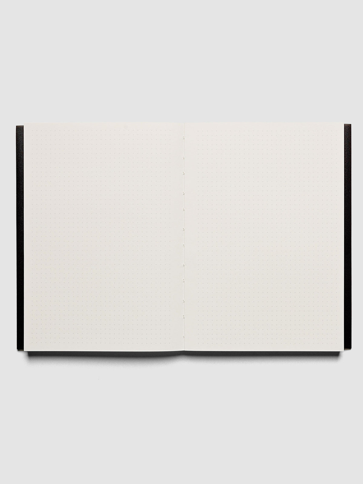 Perfect Bound Notebook | A5 | Dot Grid | Avant Garde shown open, laying flat, displaying the dot grid layout.