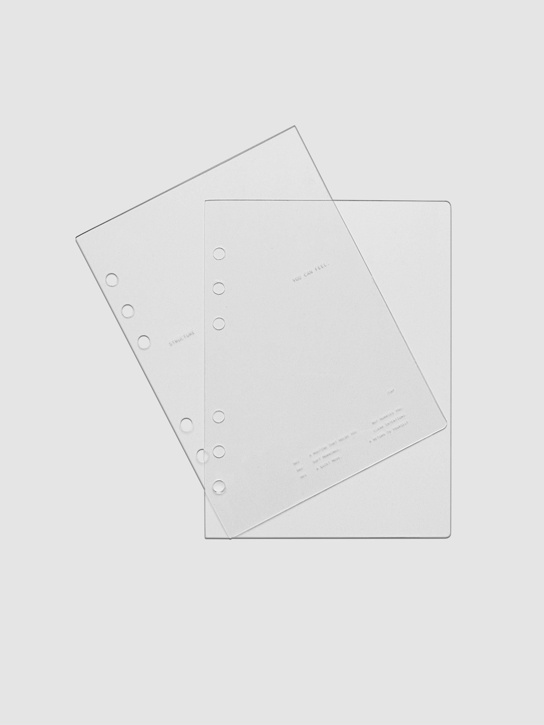 Personal Wide sized crystal clear plastic planner cover set with text printed on the cover on the theme of structure and routines.