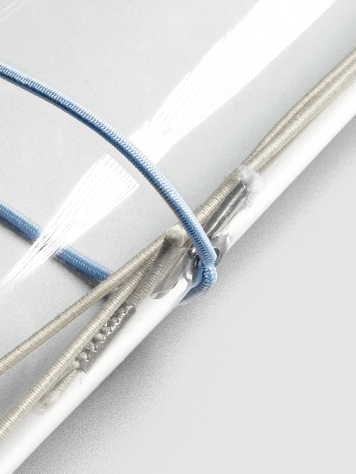 Close up image of the light blue exterior band in use with a vinyl cover