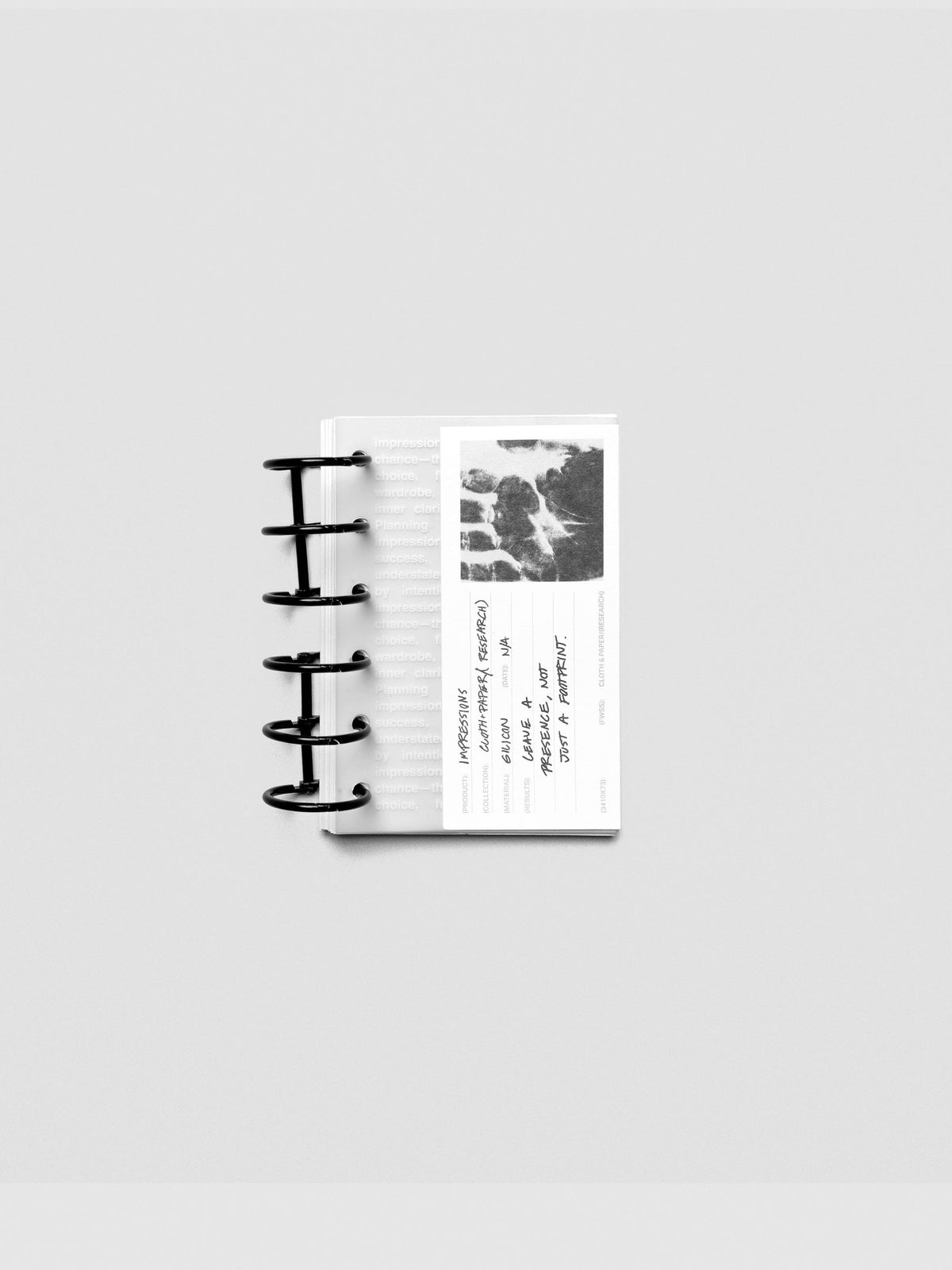 Pocket-size Impressions Dashboard styled flat with minimal planner accessories.