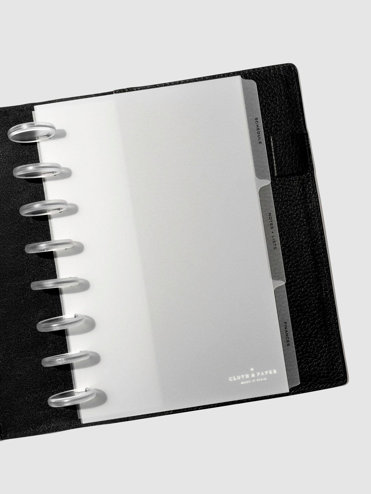 Black foil tabs displayed in use inside a leather folio.