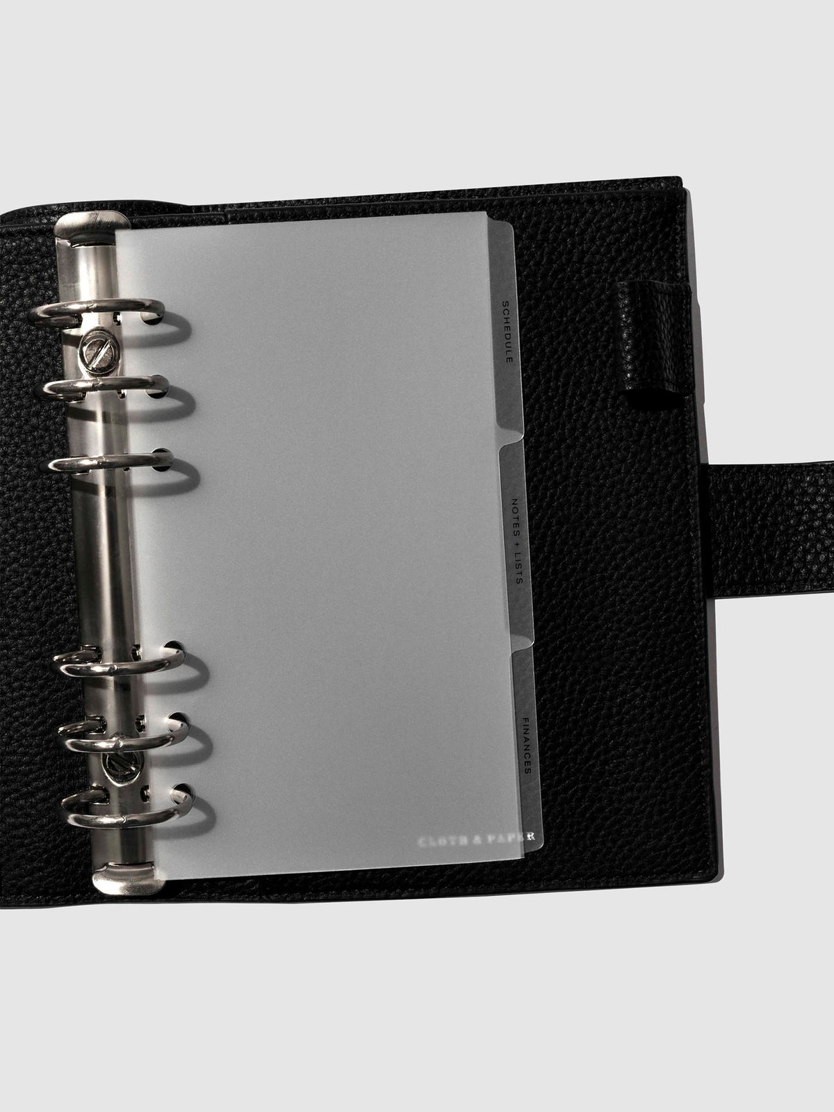 Black foil tabs displayed in use inside a leather folio.