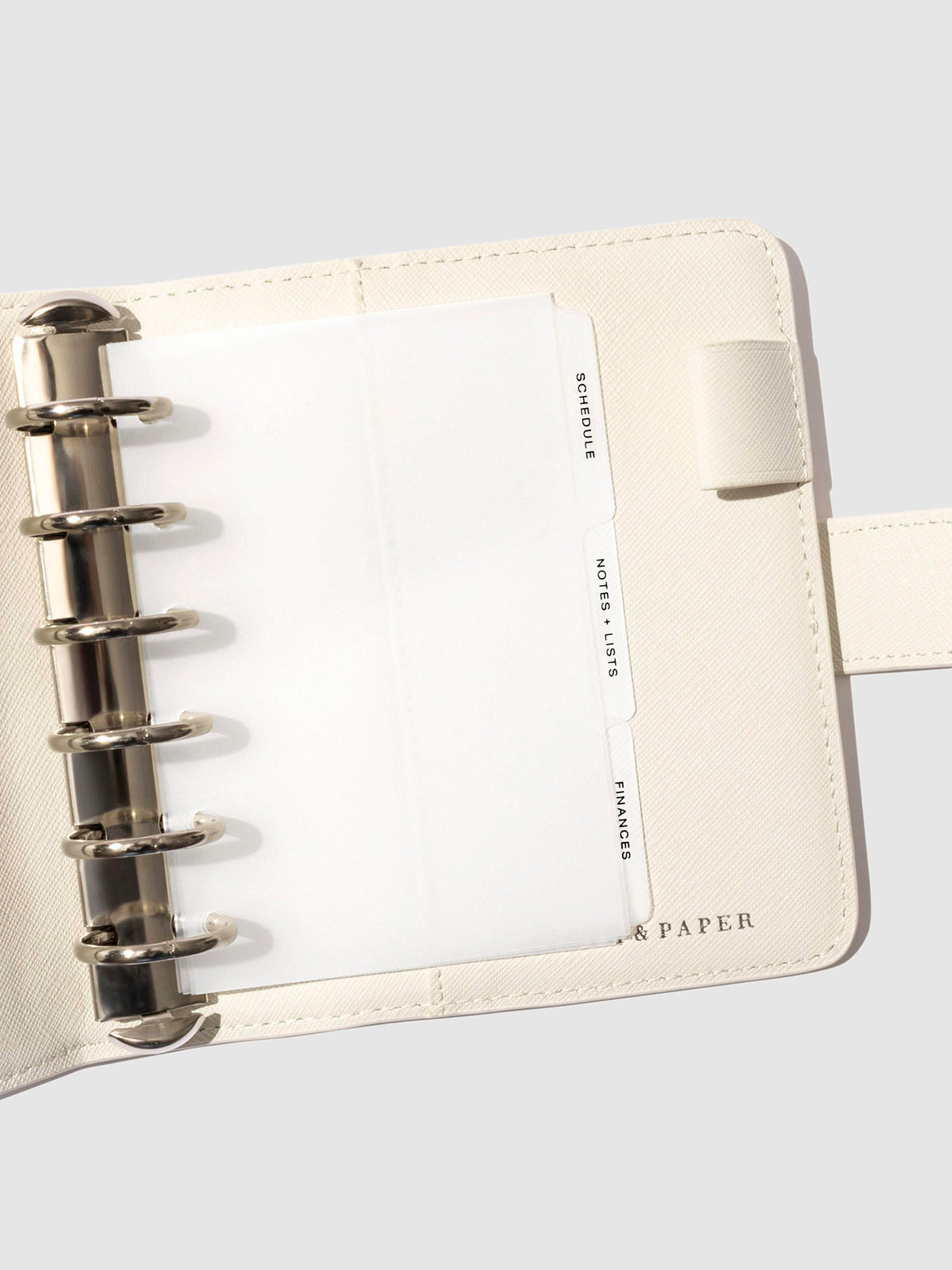 Black foil tabs displayed in use inside a leather folio.