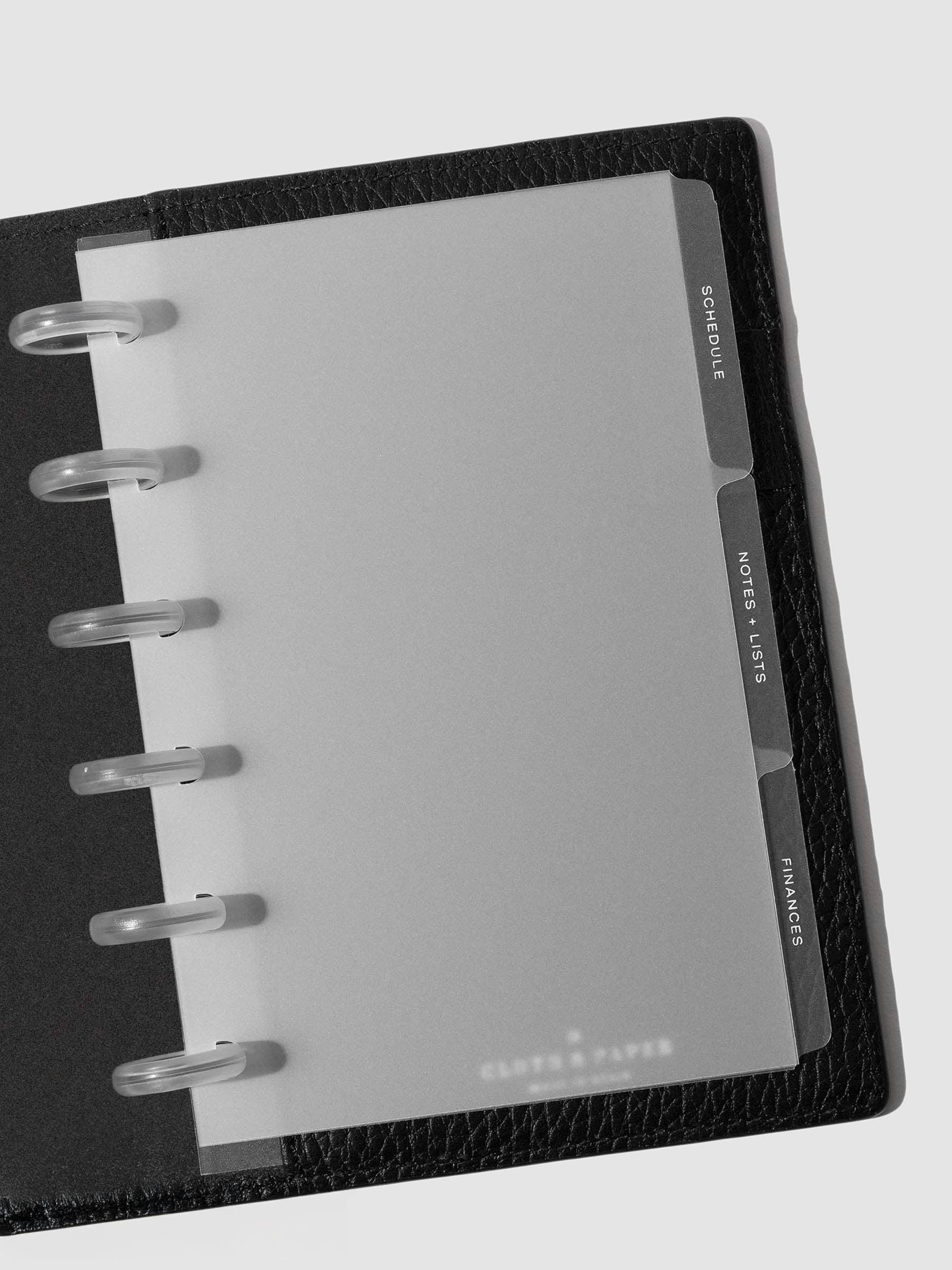 White foil tabs displayed in use inside a leather folio.