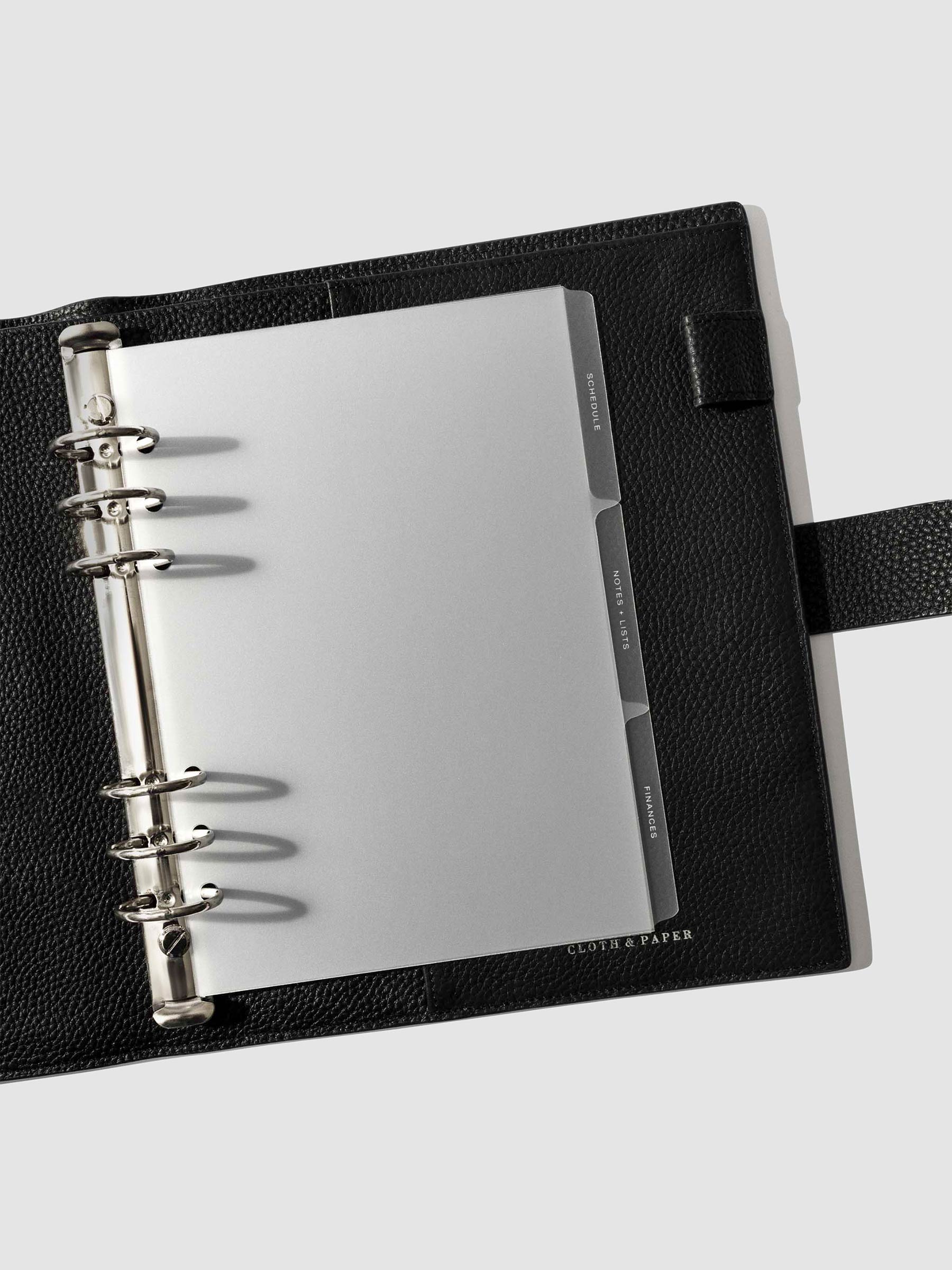 White foil tabs displayed in use inside a leather folio.