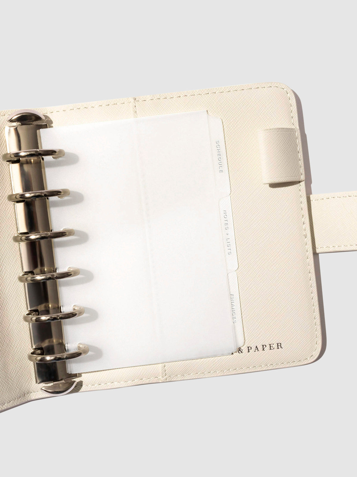White foil tabs displayed in use inside a leather folio.