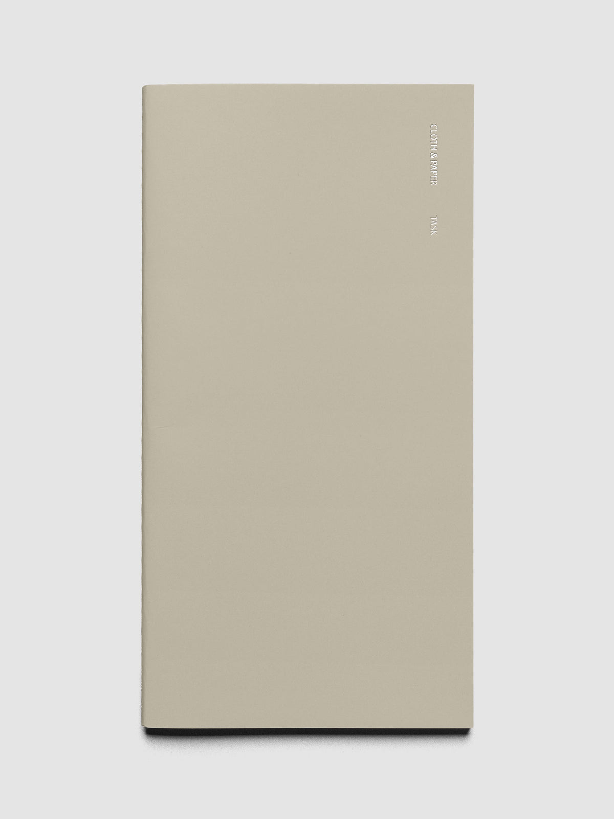 Travel Notebook in size A5 Slim in the color Ristretto with Task layout shown closed from the front against a neutral background.