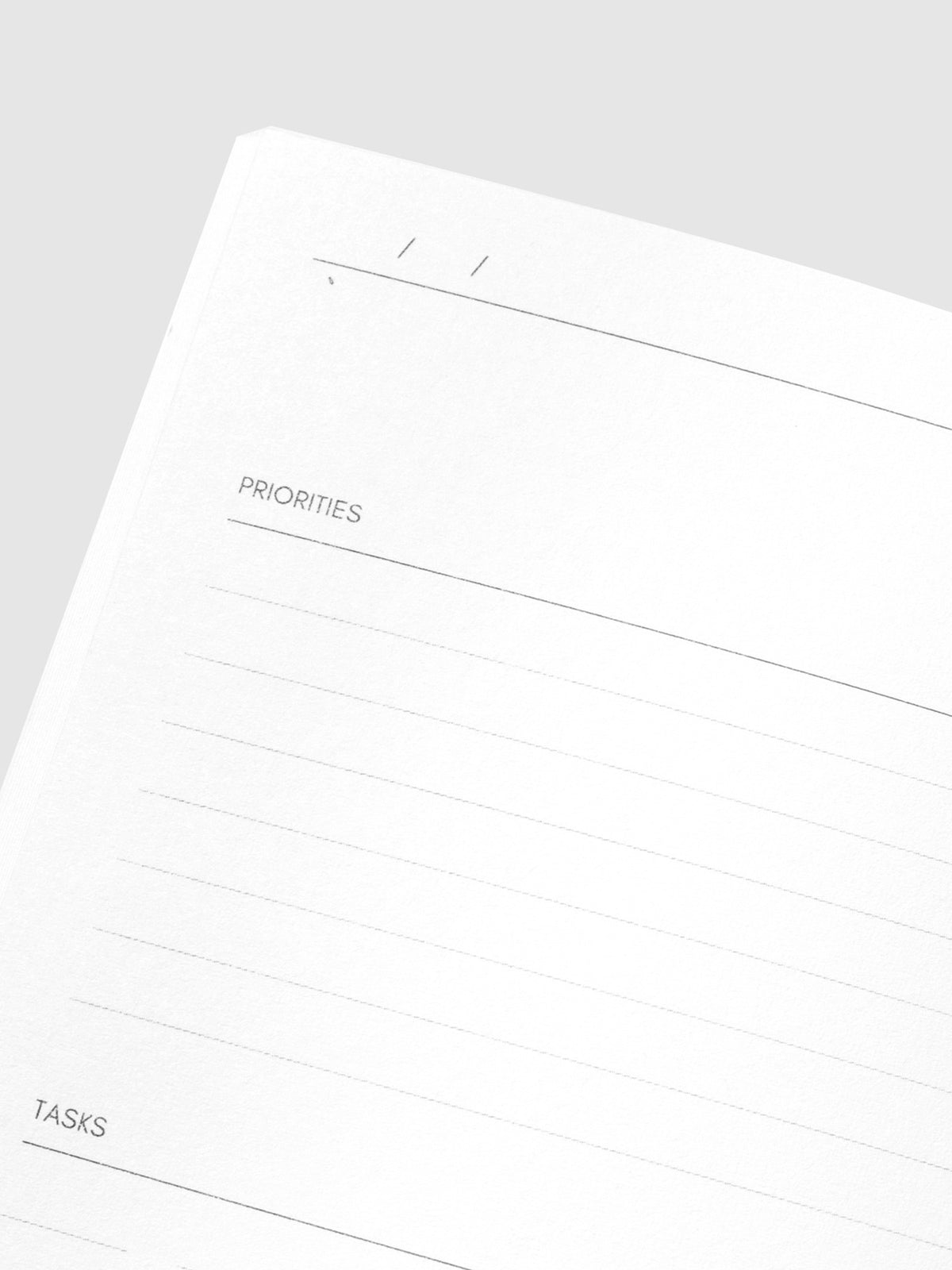 Close up image of the top left of the Undated Pocket Plus notebook page. The page is displayed on a neutral background.