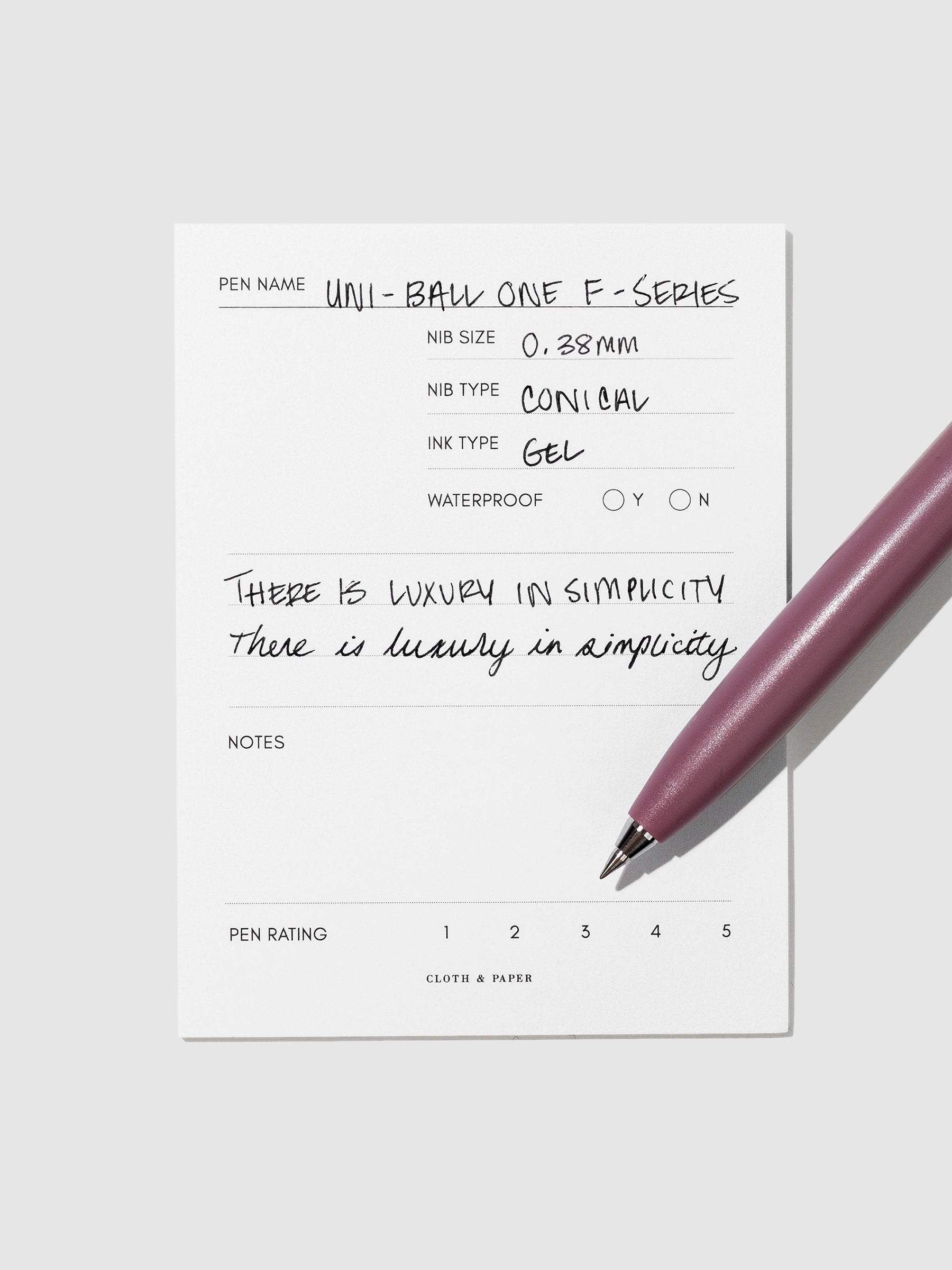 Chery pen resting on an in use pen test sheet.