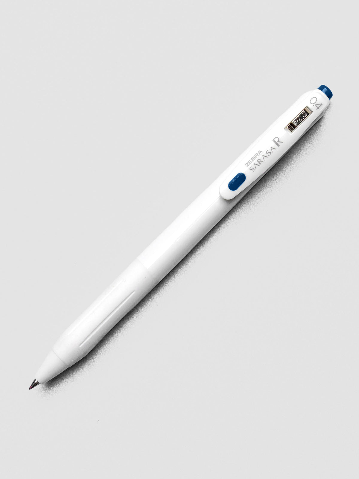 Zebra Sarasa R 0.4mm pen in blue-grey ink with matching clip, displayed on a white background.