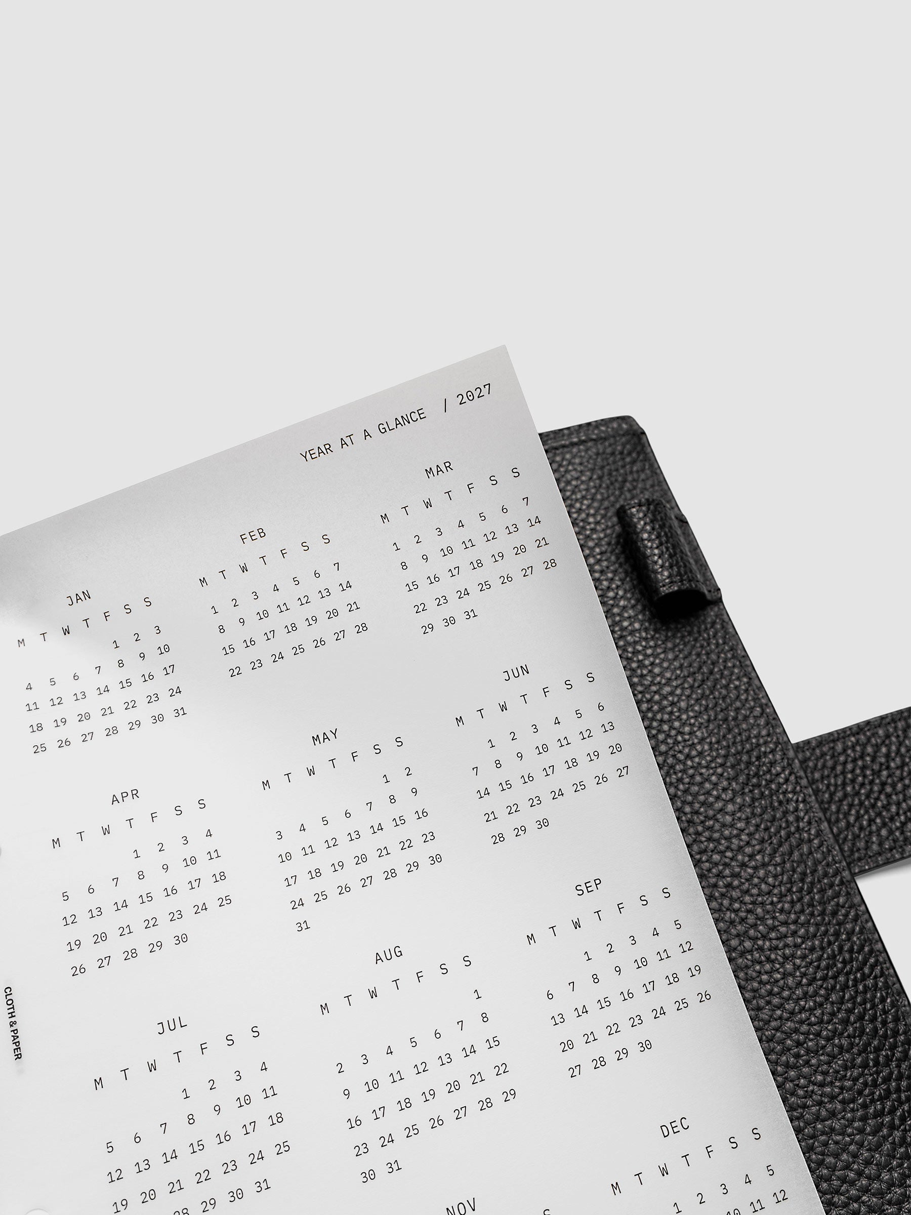 2027 Year At A Glance Dashboard Monday Start, A5 6-Ring Punch, close-up of the top right corner of the vellum dashboard showing calendar month detail and Monday-start grid layout