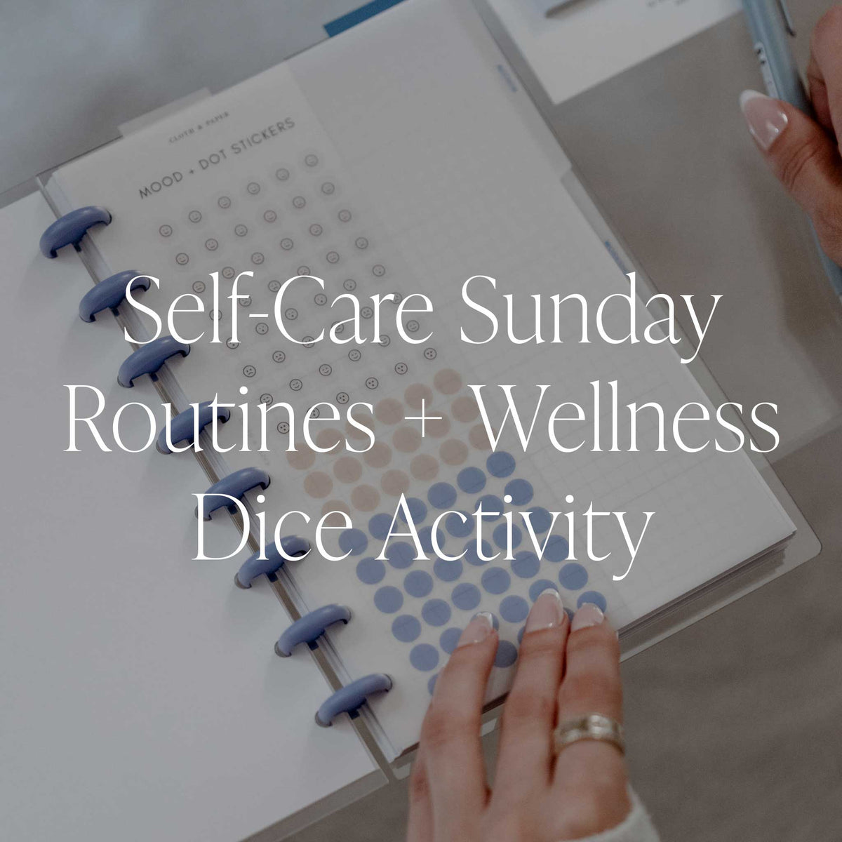 An image showing a woman holding her Candid Journal with Mood Stickers from October Intention Box, with text overlay that reads: "Self-Care Sunday Routines + Wellness Dice Activity."