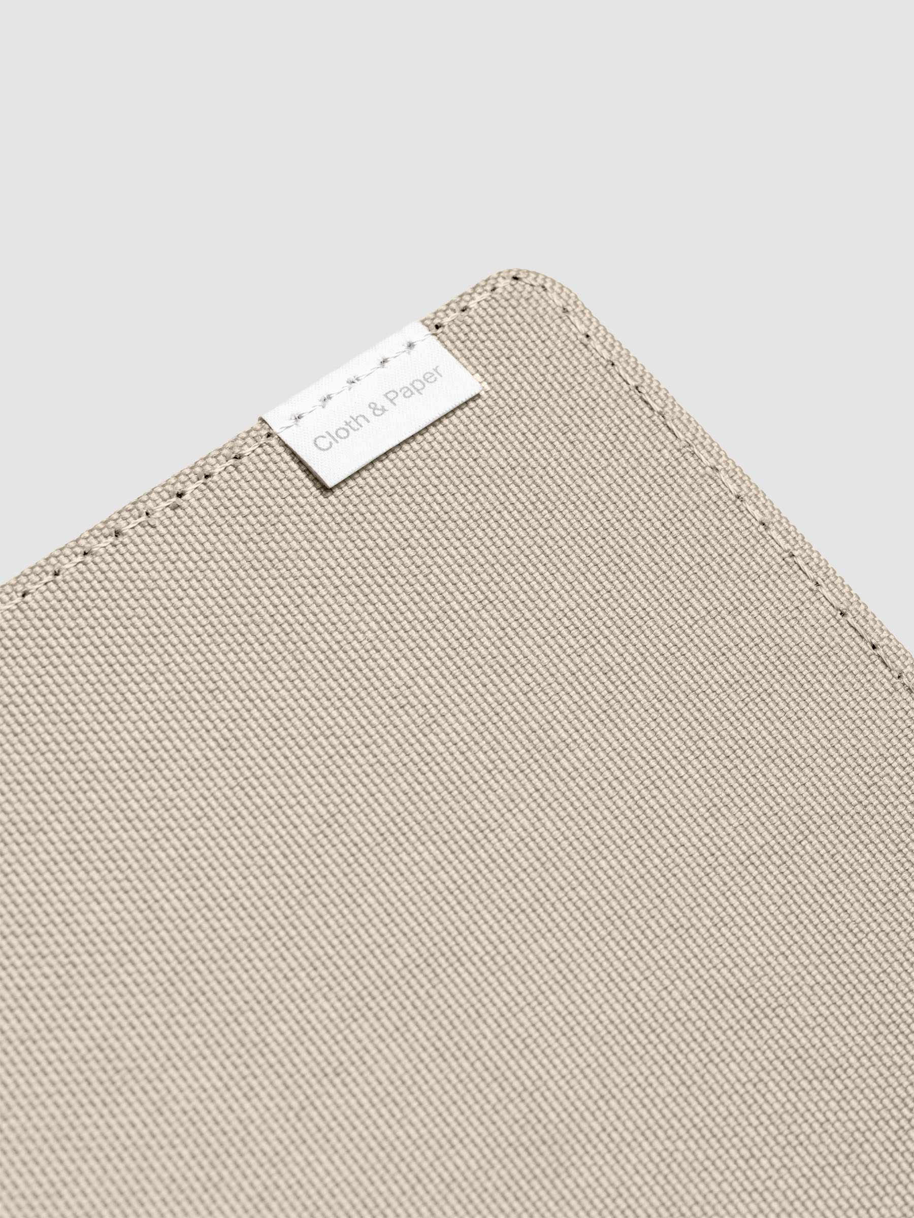 Close up of the tag on the Archive Bookcloth Planner Cover.