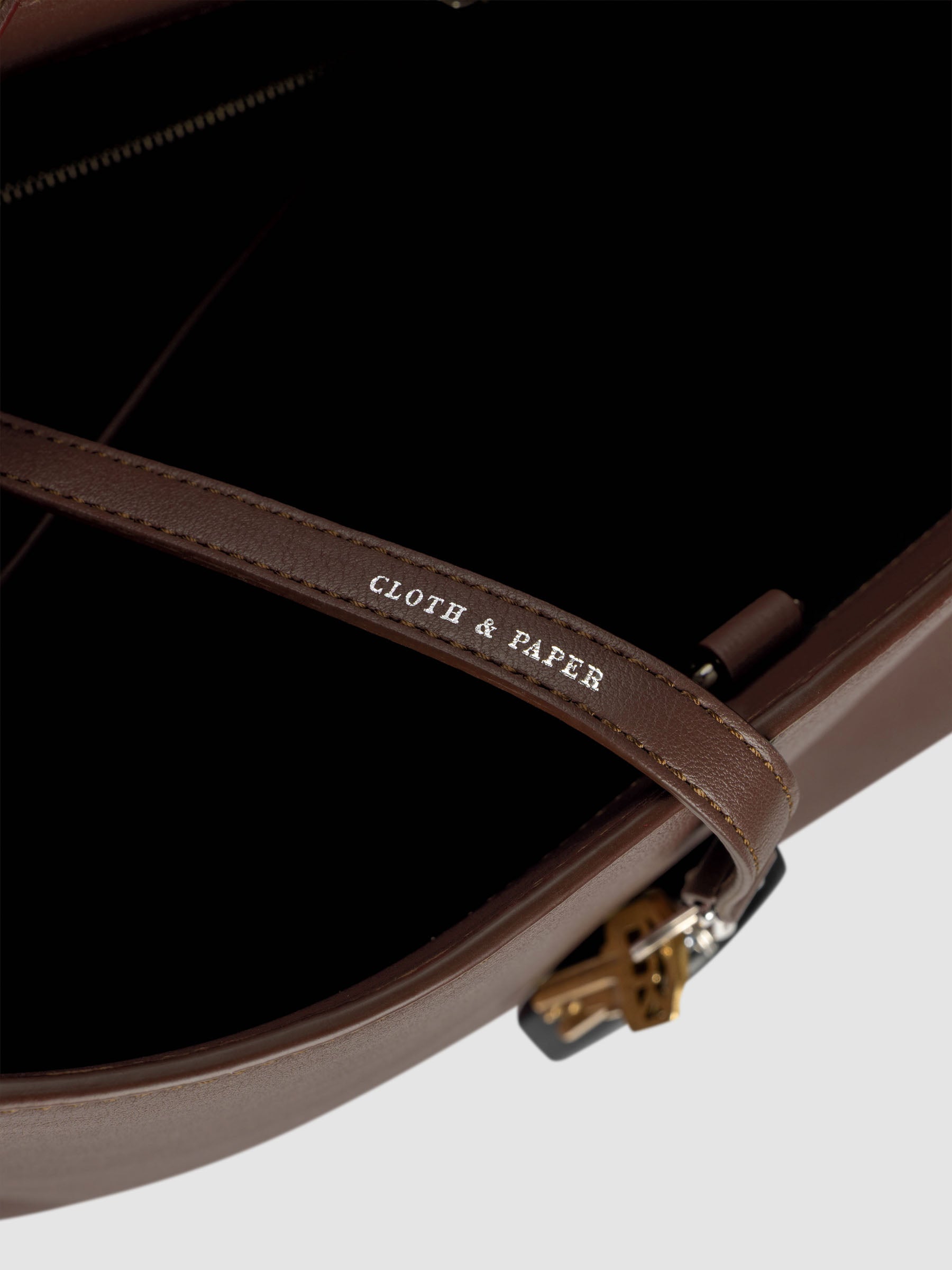 Detail view of Cloth & Paper logo foil on The Metro Tote in the color Cordoba.
