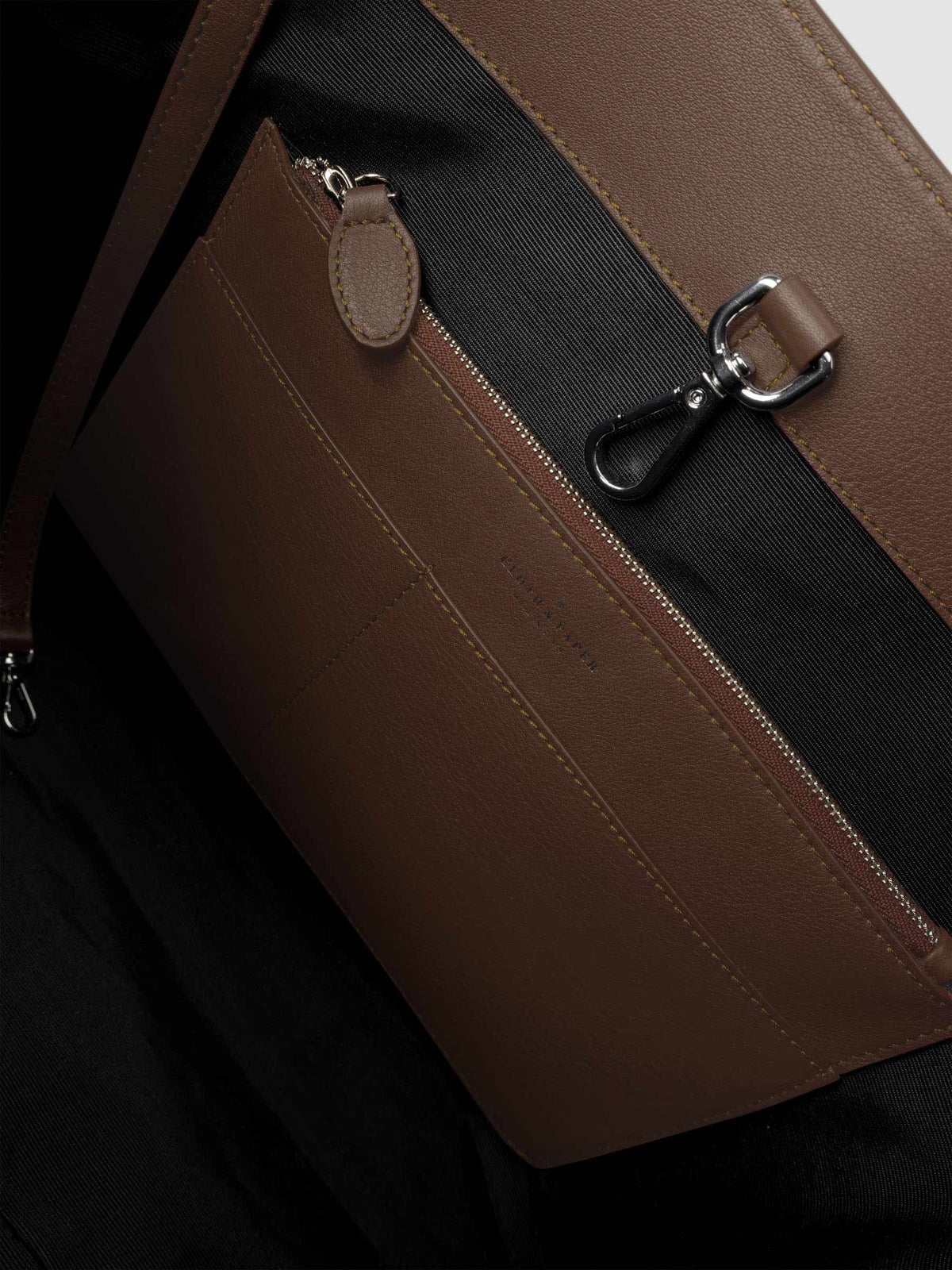 Detail view of inside of The Metro Tote in the color Cordoba.