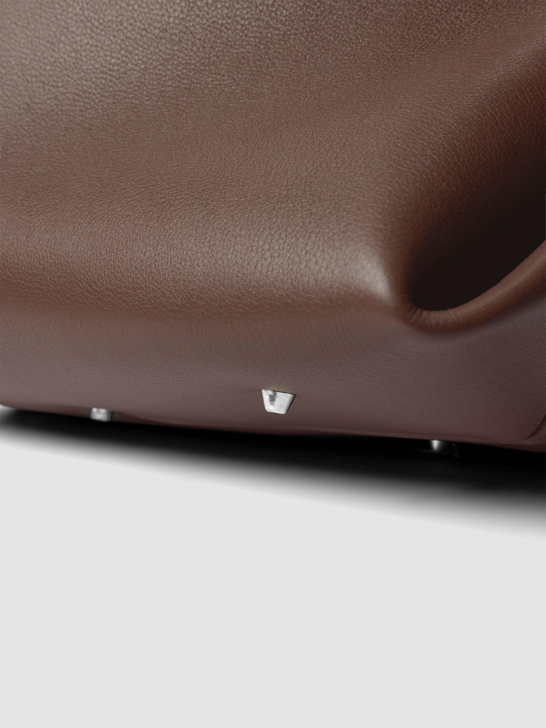Detail view of a the bottom of The Metro Tote in the color Cordoba.
