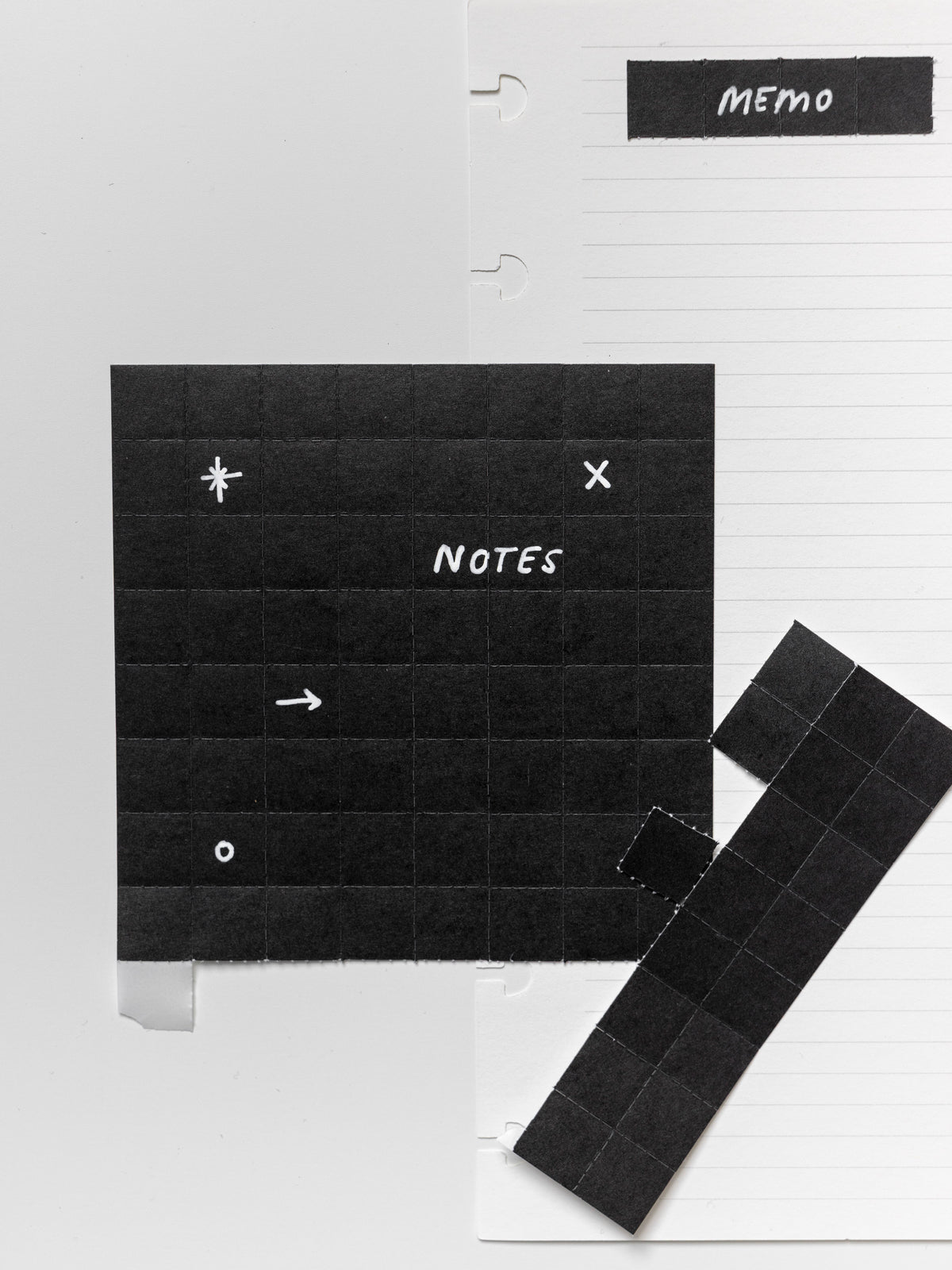 Black tear off stickers with white text