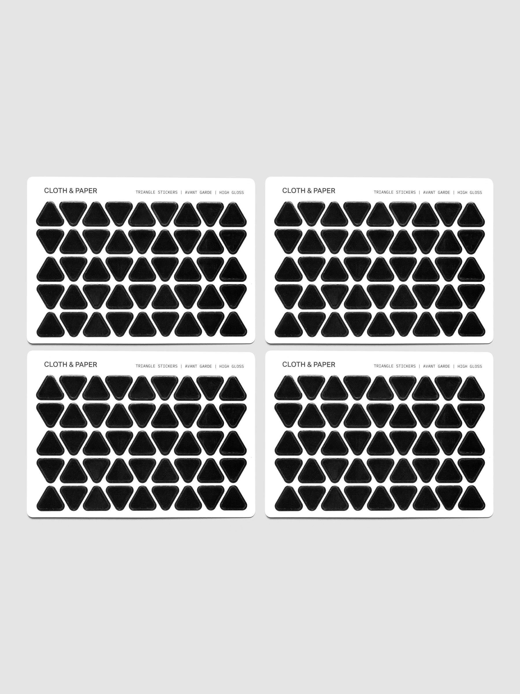 Four sheets of high gloss, black triangle stickers