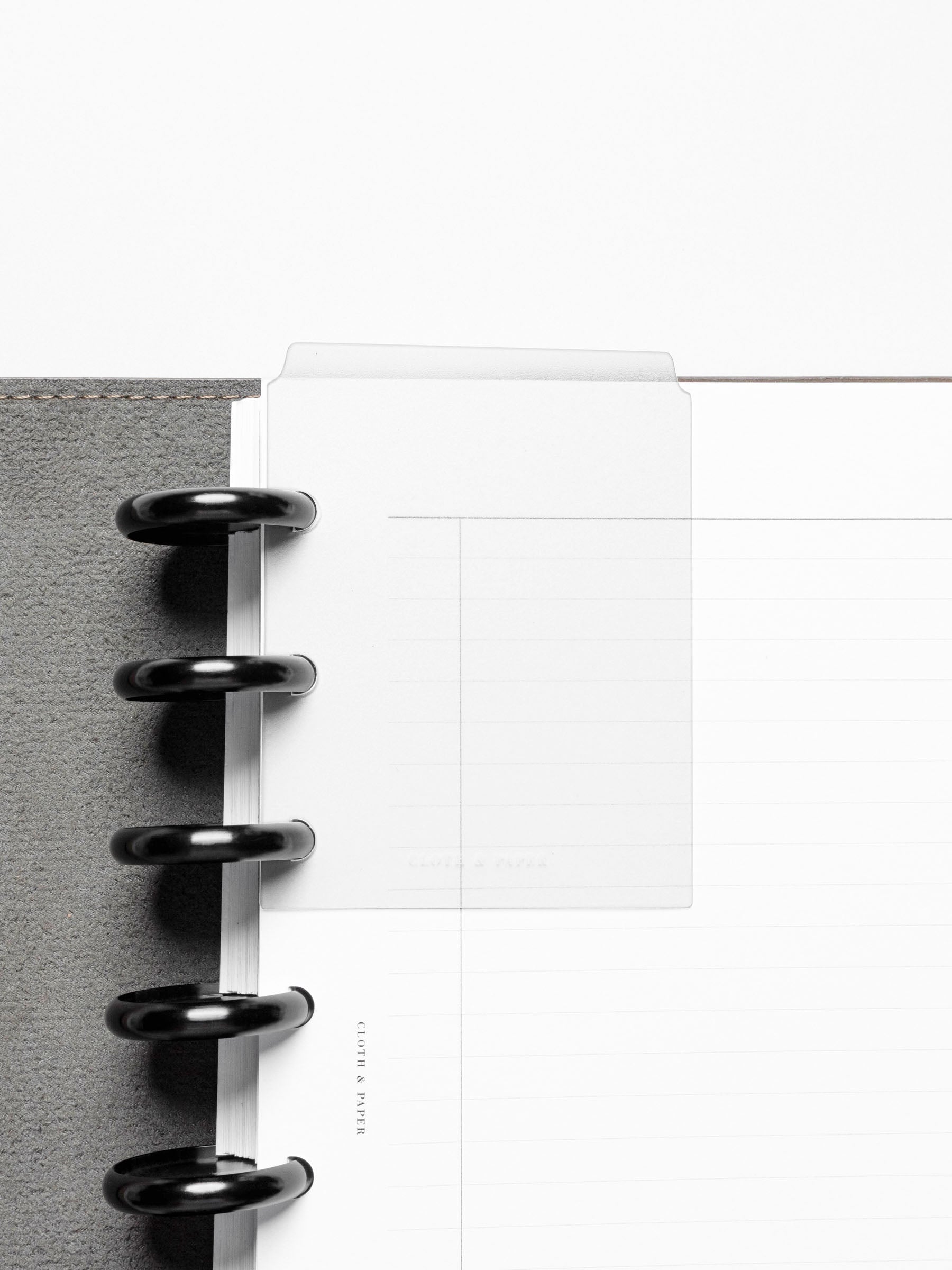 Page marker in use with a discbound planner.