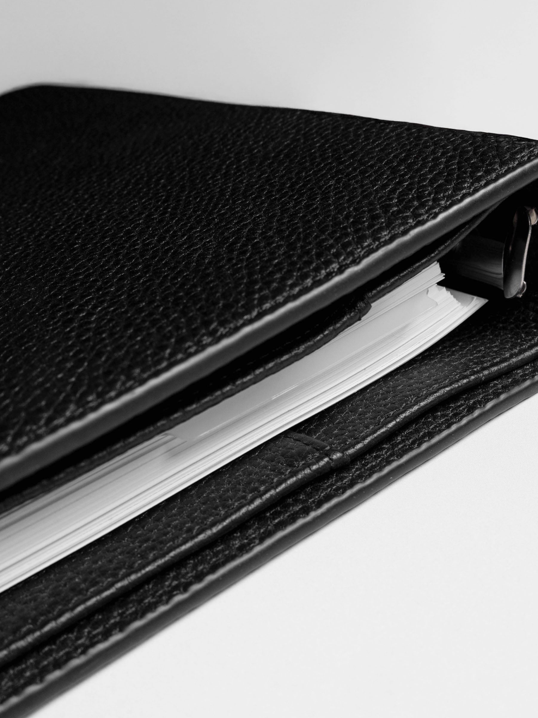 Page marker shown protruding from ring bound planner.