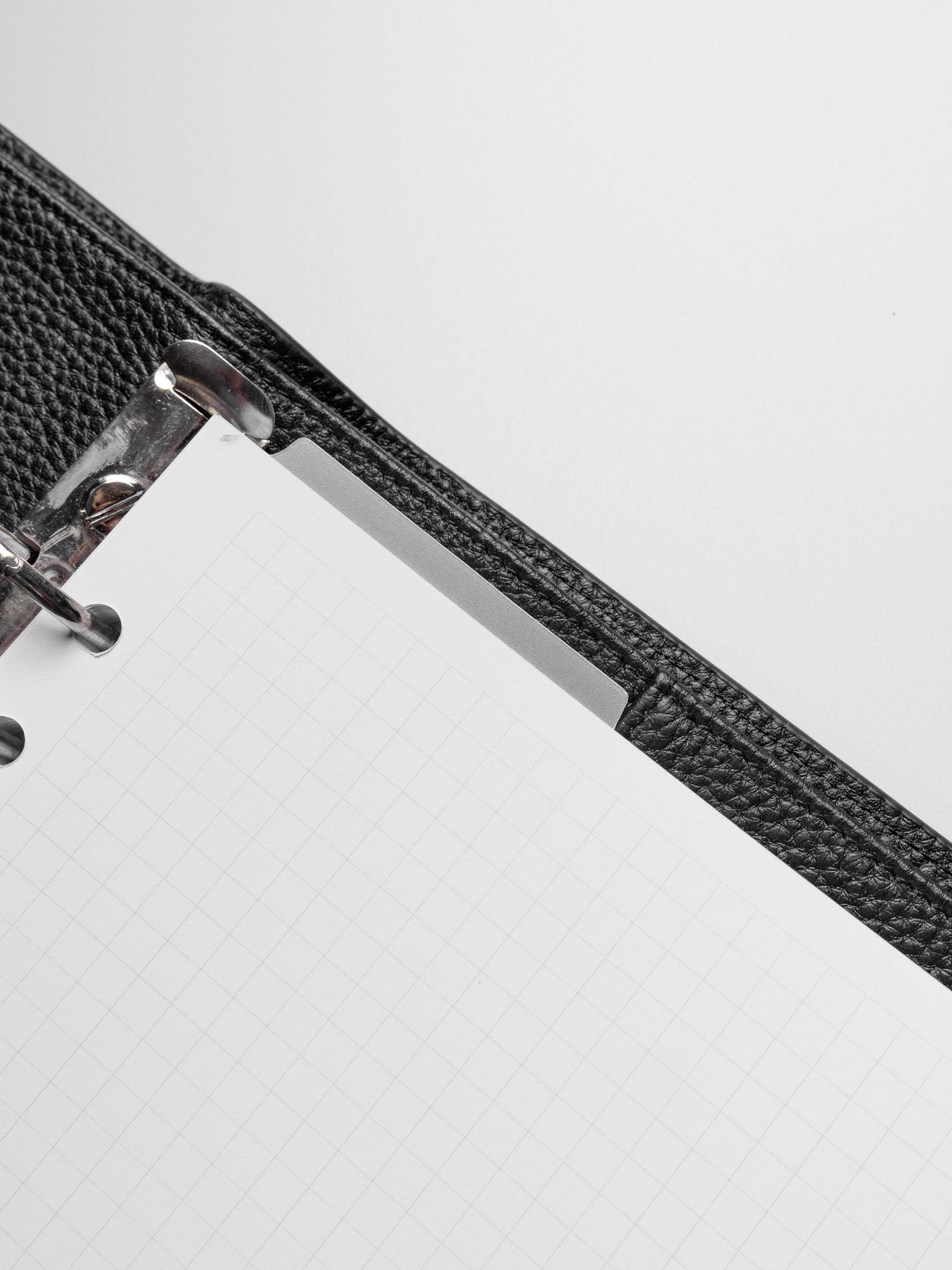 Page marker shown protruding from ring bound planner.