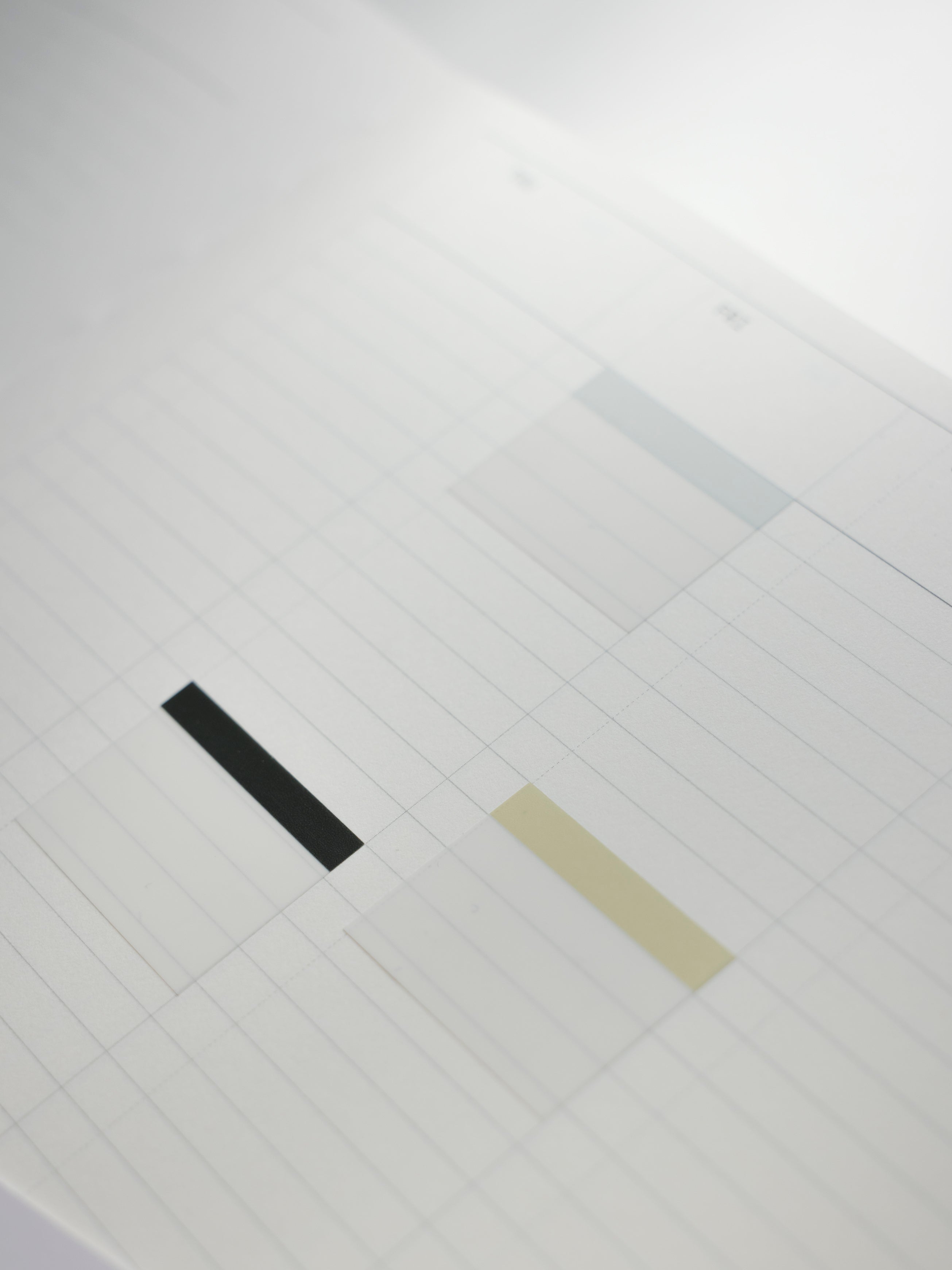 Light blue, light green, and charcoal index page flags applied to a planner page