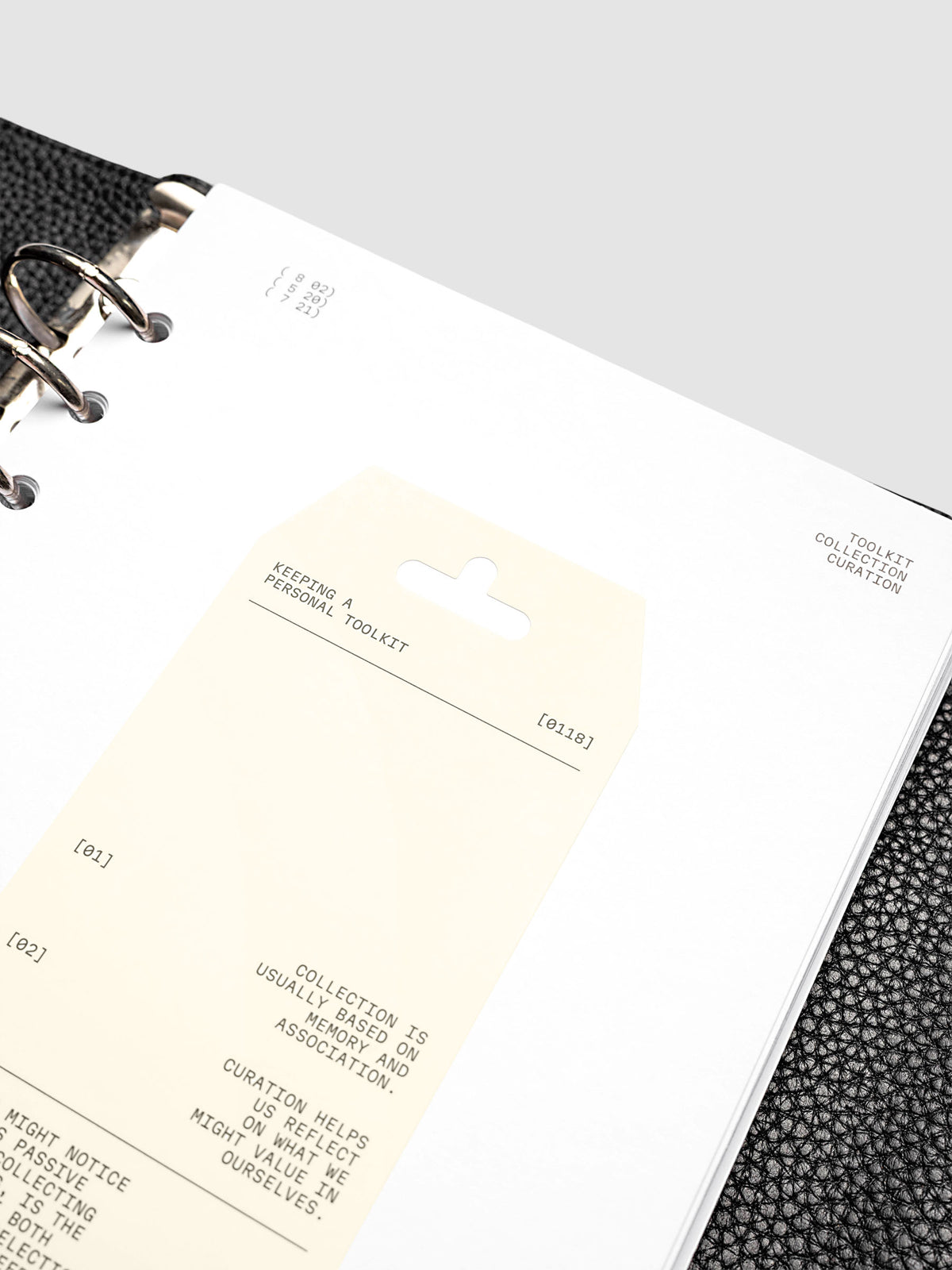 Personal Toolkit Planner Dashboard in A5 6-Ring Punch, a cardstock dashboard with an affixed warm gray printed tag in black type on a light gray background