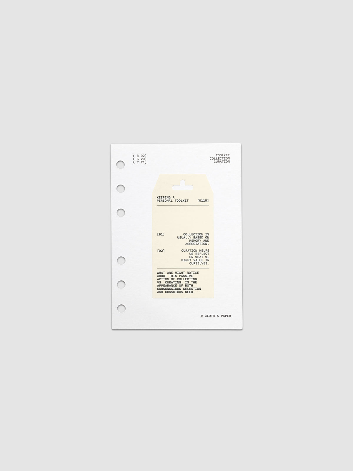 Personal Toolkit Planner Dashboard in A6 6-Ring Punch, a cardstock dashboard with an affixed warm gray printed tag in black type on a light gray background