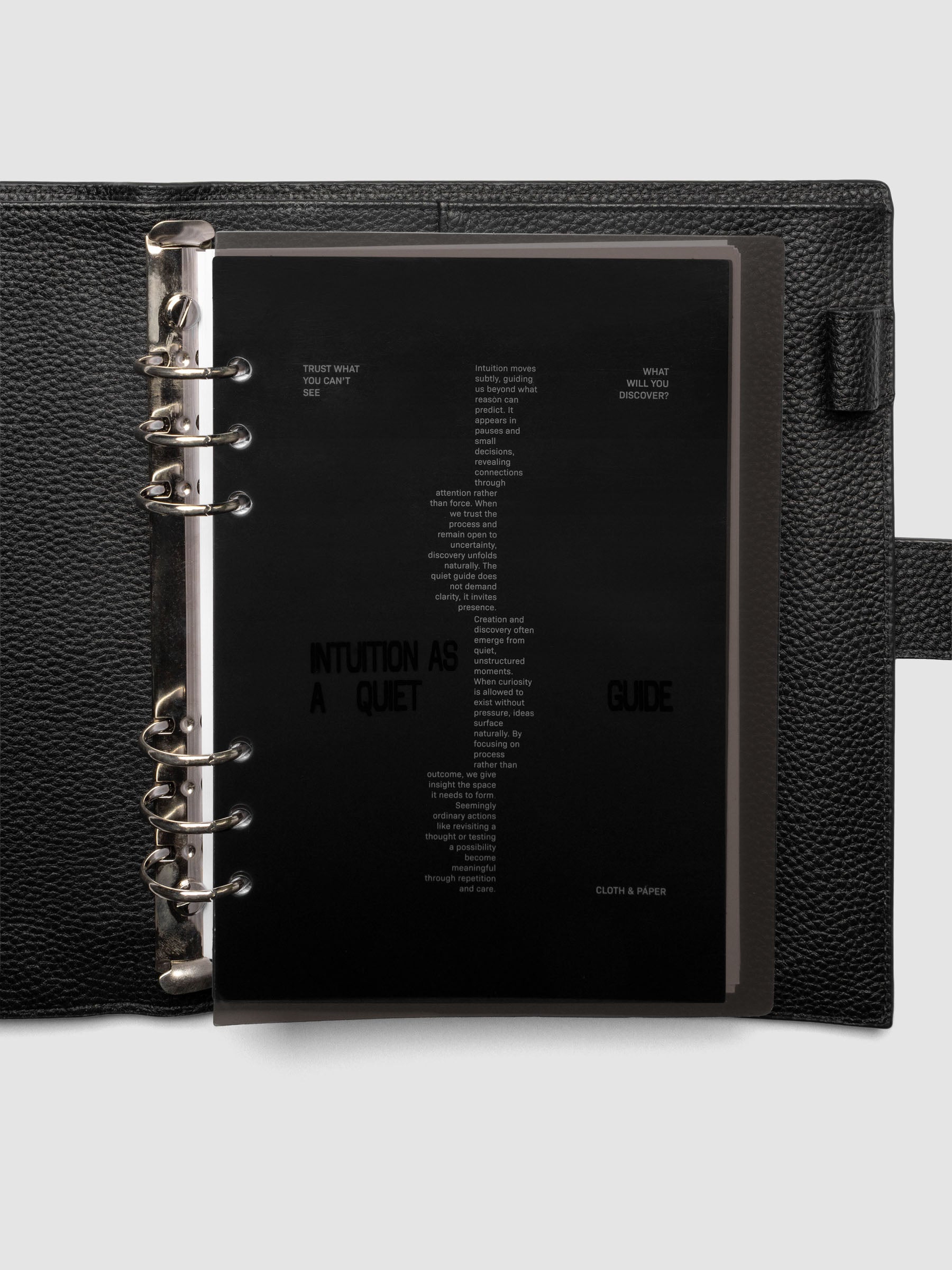 Black Intuition Ultra Thin Planner Cover + Dashboard Set in size A5 6-Ring Punch shown inside a planner