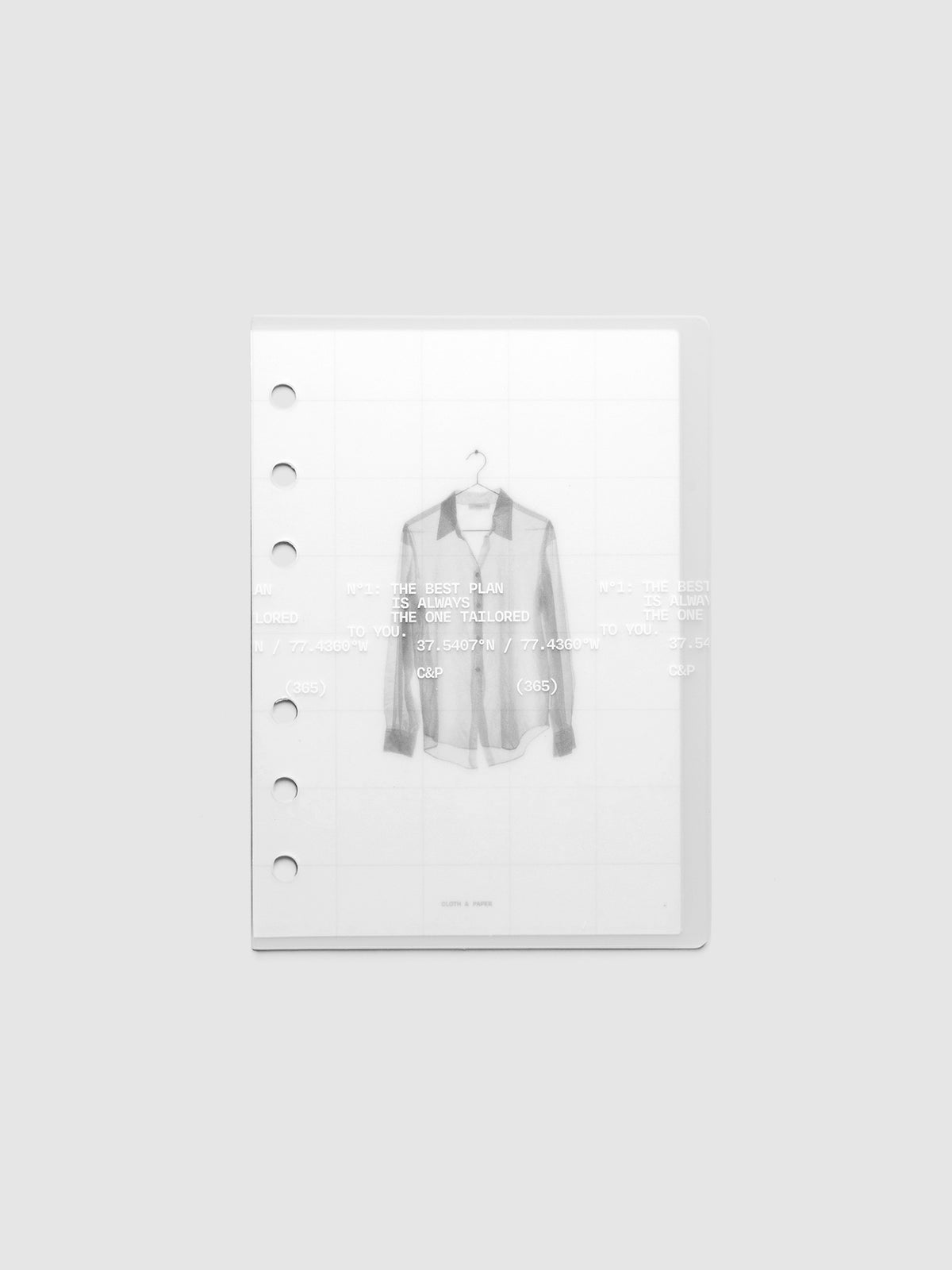 Transparent planner cover set with white printed text design and accompanying black and white dashboard with an image of a tailored shirt on a hanger. Pre-punched for 6-ring planners shown in size A6.