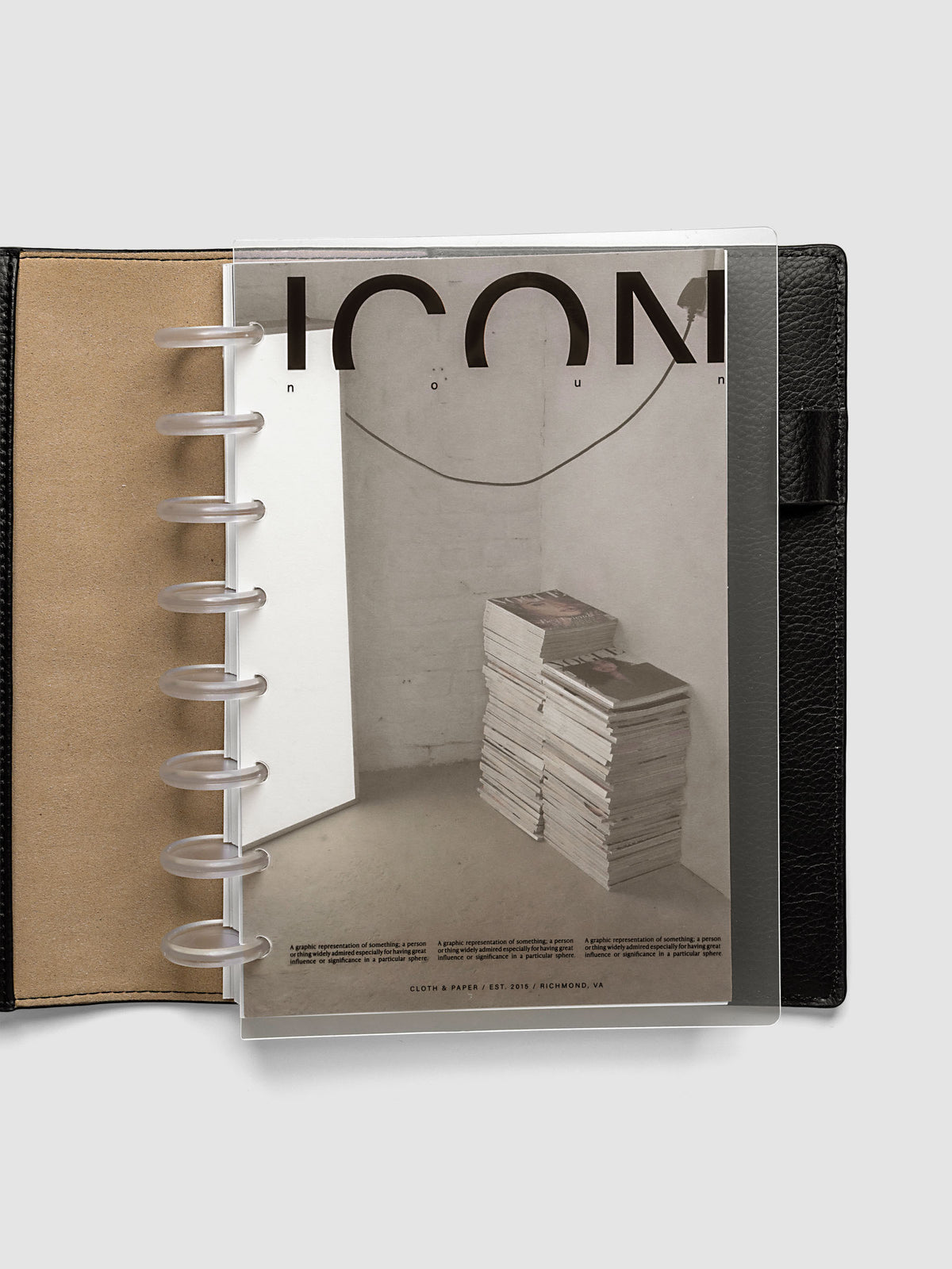 Clear planner cover with black text and a photographic dashboard shown pre-punched for discbound planners in size Half Letter in a black folio.