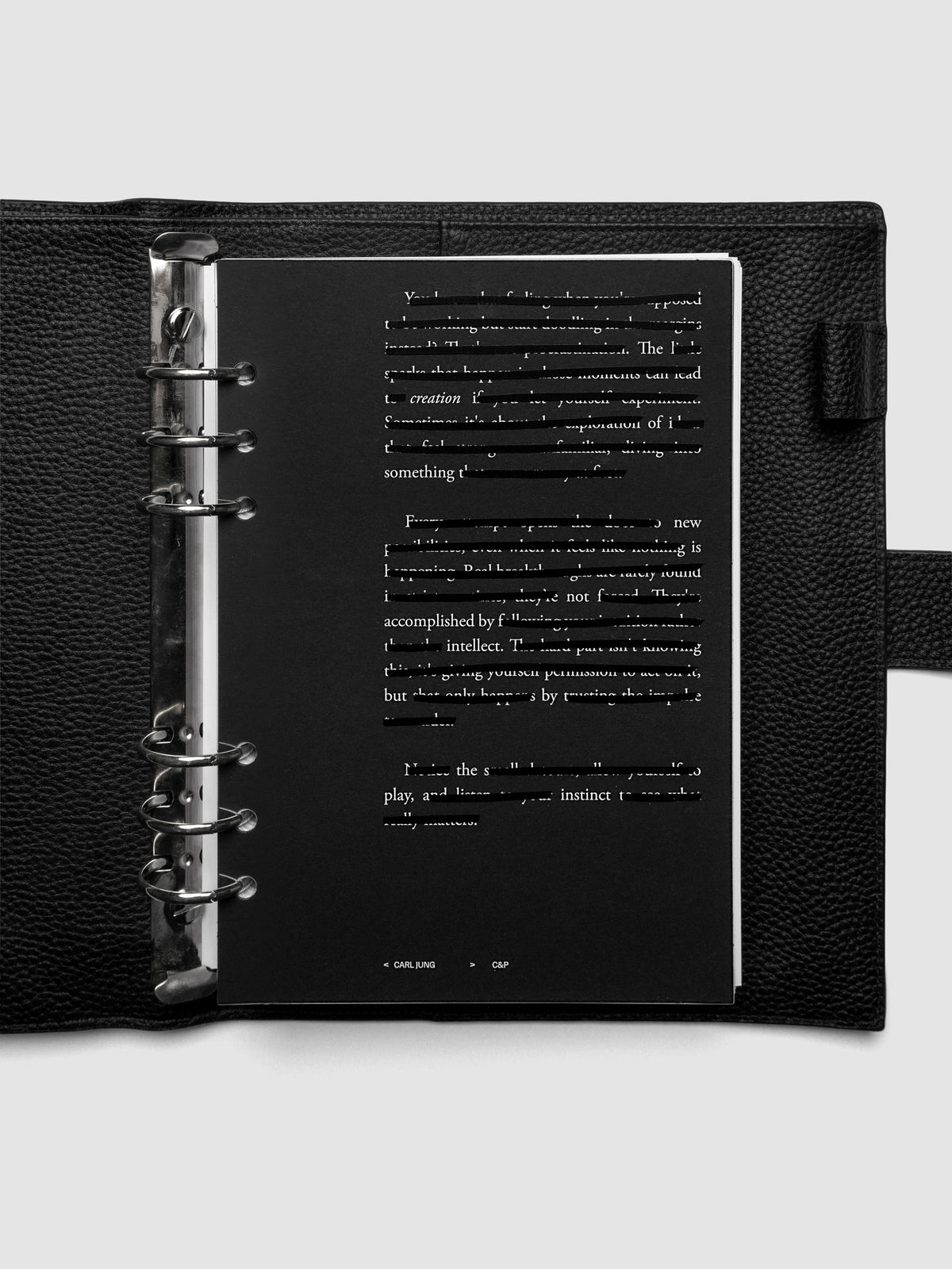 Black, white, and transparent dual layer planner dashboard shown in size A5 6-Ring Punch inside a planner